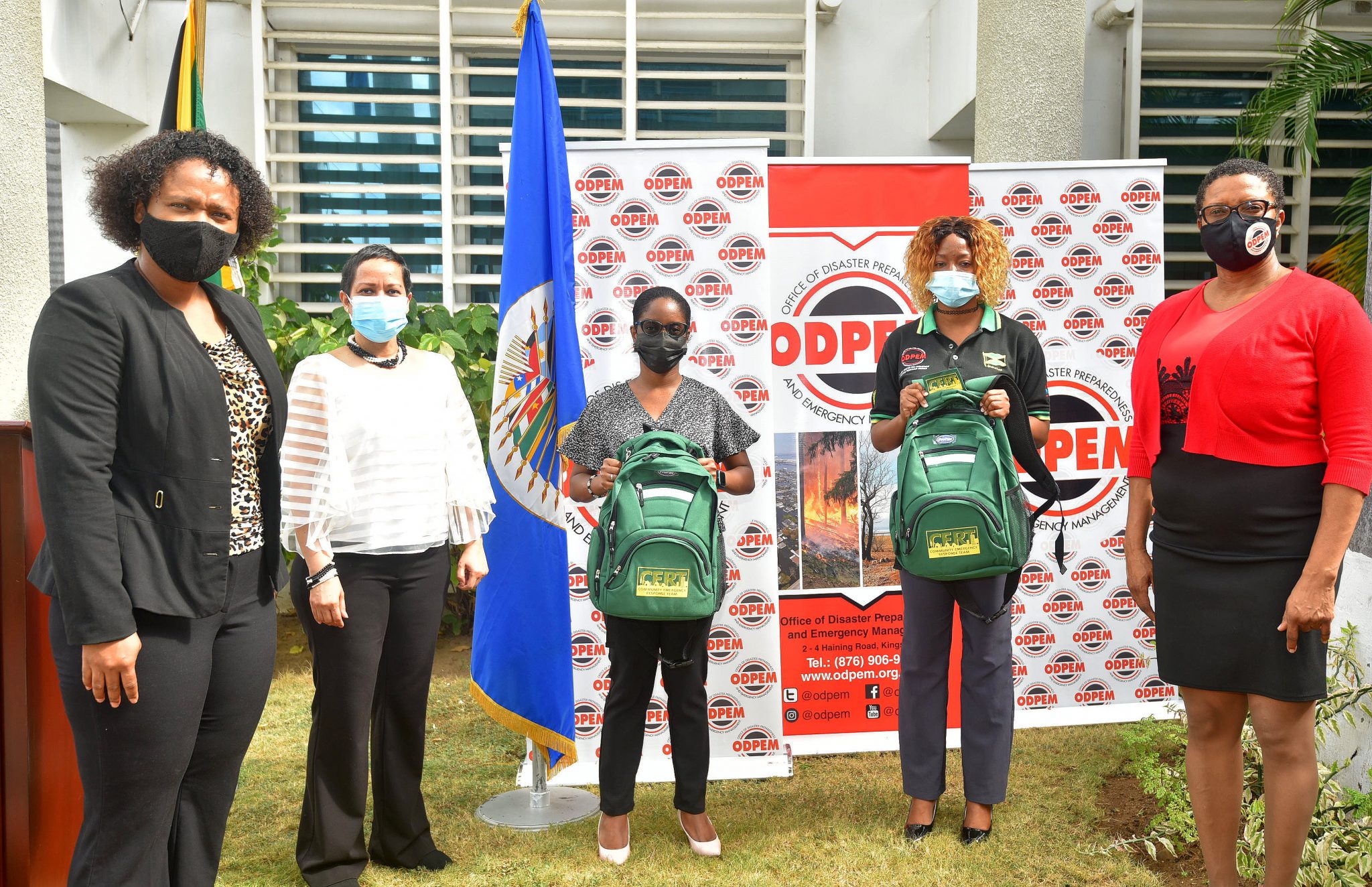 Resident Representative of the Organization of American States (OAS), Jeanelle van GlaannenWeygel (second left) and Director of Training and Information at the Office of Disaster Preparedness and Emergency Management (ODPEM), Delmares White (right), with ODPEM’s Training Officer, Kristen Rhone (centre) and Coordinator for the National Disaster Risk Management Volunteer Programme, Diamonette Syncon (second right), who both completed Basic Community Emergency Response Team (CERT) training with the OAS. Both women were handed emergency kits with equipment to carry out fieldwork at a handover ceremony, held at ODPEM’s New Kingston Offices, on February 22. At left is OAS Administrative Technician, Kerry-ann Parchment.