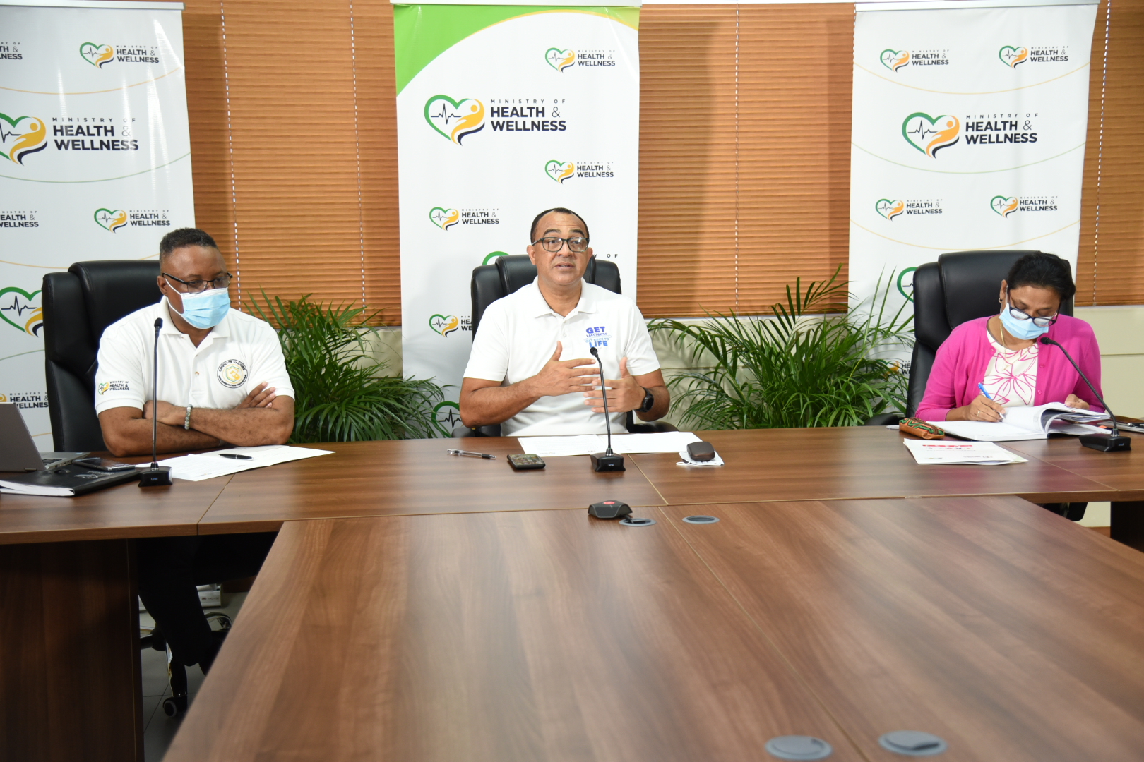 Minister of Health and Wellness, Dr. the Hon. Christopher Tufton (centre), responds to queries from media personnel during the weekly virtual COVID Conversations press briefing on Tuesday (March 23). Flanking Dr. Tufton are Permanent Secretary in the Ministry, Dunstan Bryan; and Chief Medical Officer, Dr. Jacquiline Bisasor-McKenzie.

