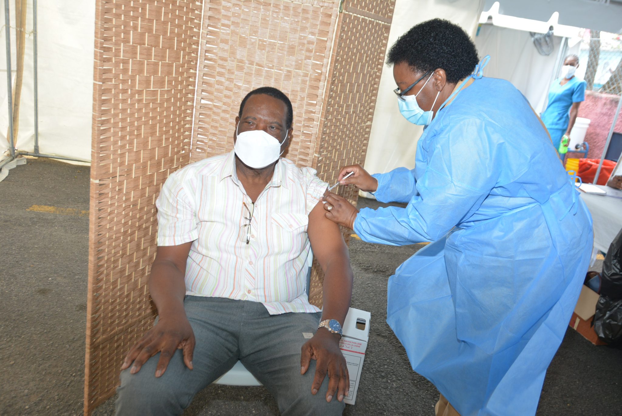 Mayor of Montego Bay, Councillor Leeroy Williams (left), receives the coronavirus (COVID-19) vaccine from Public Health Nurse at the St. James Public Health Department, Claudette Trought Gordon. The vaccine was administered at the Montego Bay Type Five Health Centre on Monday (March 22).

