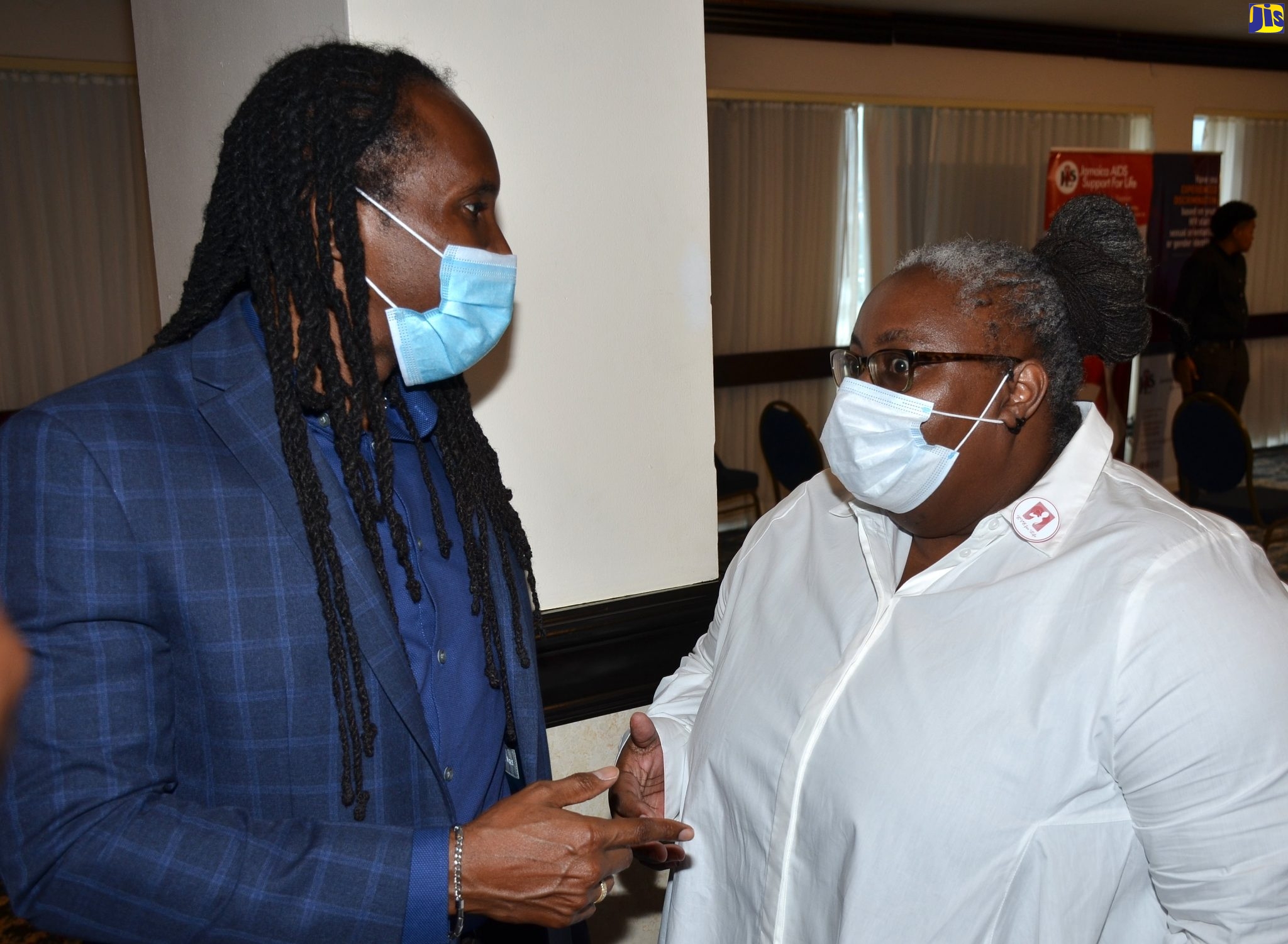 State Minister in the Ministry of Culture, Gender, Entertainment and Sport, Hon. Alando Terrelonge (left), converses with Executive Director, Eve for Life, Lovelet Crawford, at the Jamaica AIDS Support for Life (JASL) HIV, Law and Human Rights Symposium on March 8. The virtual event was part of activities to mark  International Women’s Day 2021.