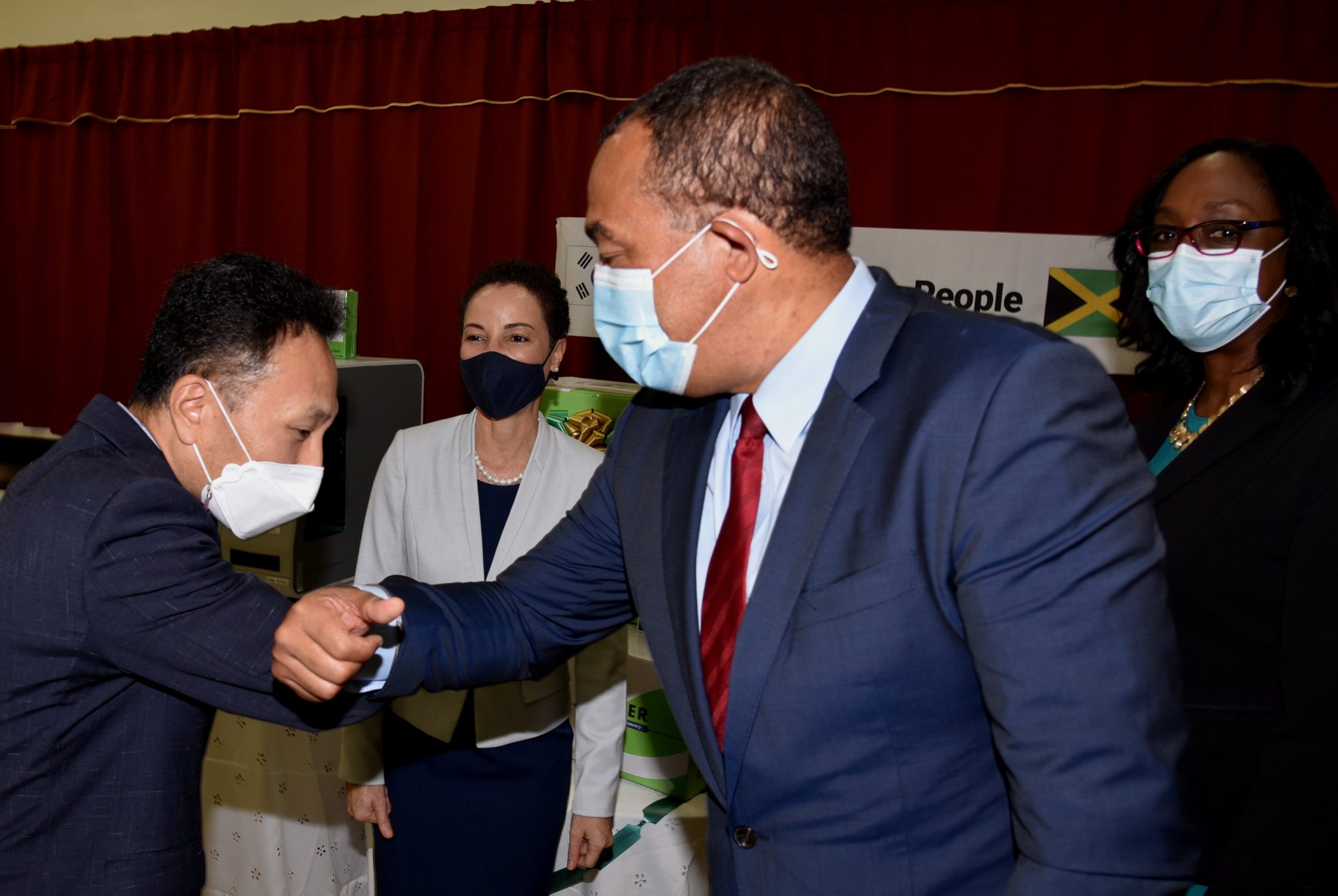 Minister of Health and Wellness, Dr. the Hon. Christopher Tufton (right), greets Chargé d