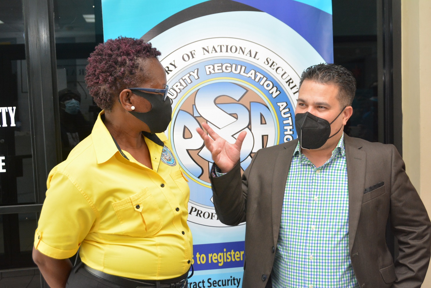 Minister without Portfolio in the Ministry of National Security, Hon. Matthew Samuda (right), in discussion with  Operations Manager, Private Security Regulation Authority (PSRA), Vivette Webber-McLaughlin, during a tour of the PSRA Regional Office in Montego Bay, St. James, recently.