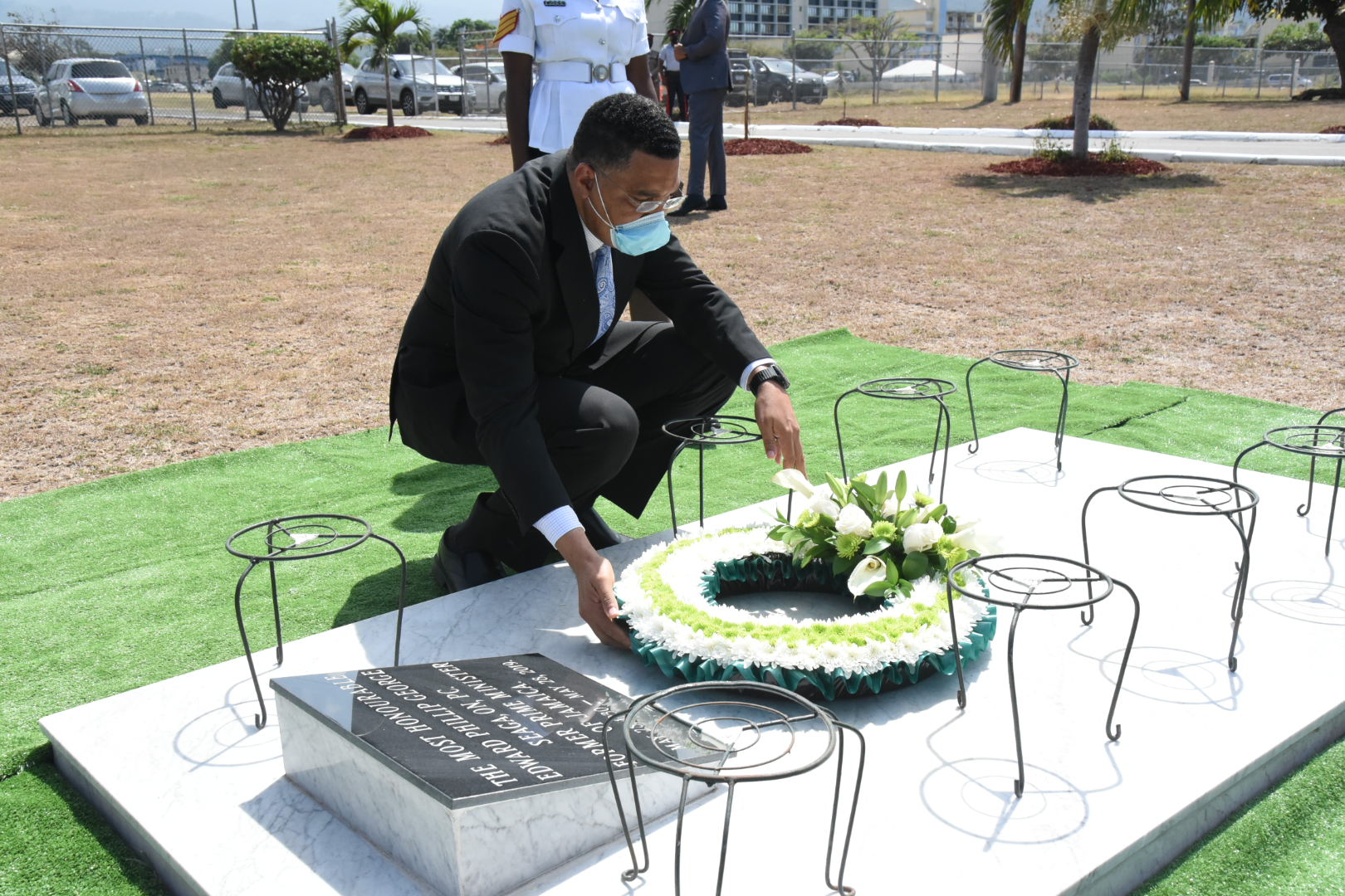 Prime Minister, the Most Hon. Andrew Holness, lays a floral tribute at the grave of late former Prime Minister, the Most Hon. Edward Seaga, during a commemorative ceremony held on May 28 at National Heroes Park in Kingston, to mark the 91st anniversary of Mr. Seaga