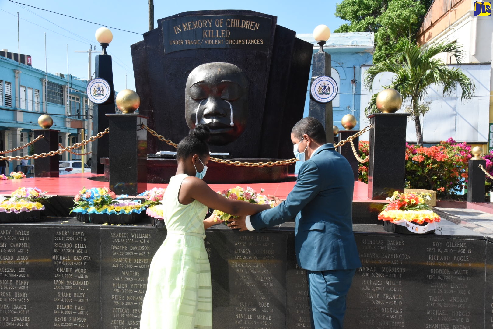 Kingston’s Mayor, Senator Councillor Delroy Williams (right), and Kingston and St. Andrew Municipal Corporation (KSAMC) Youth Councillor Representative for the Springfield Division, Reajean Bennett, lay a wreath at the Secret Gardens Monument in downtown Kingston, during a ceremony on Sunday (May 2) in memory of the nation’s children who have died under violent/tragic circumstances. The ceremony formed part of the Corporation’s activities commemorating Child Month during May under the theme: ‘I Strive to Overcome Adversities with Resilience’ (I.S.O.A.R.).