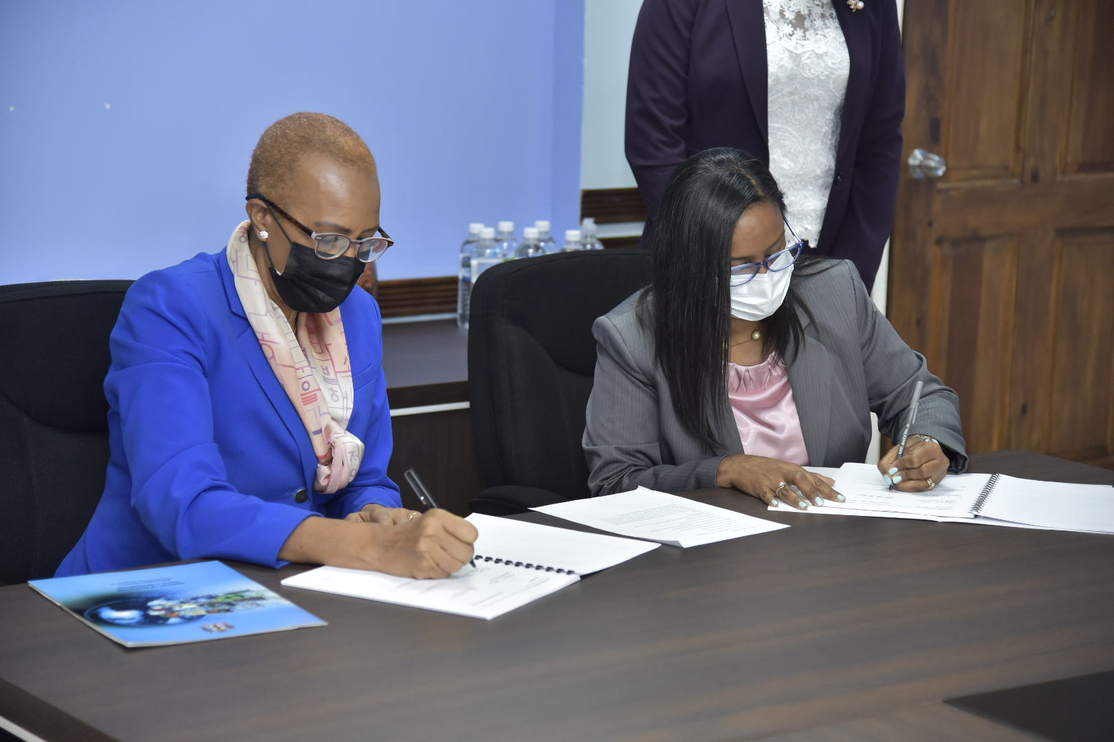 Minister of Education, Youth and Information, Hon. Fayval Williams (left)  and Chairman of Jamaica Copyright Licensing Agency (JAMCOPY), Dianne Daley McLure, sign an agreement to allow public schools to make copies of licensed works. The signing took place at the Ministry's Heroes Circle offices on Wednesday (May 5).

 

 