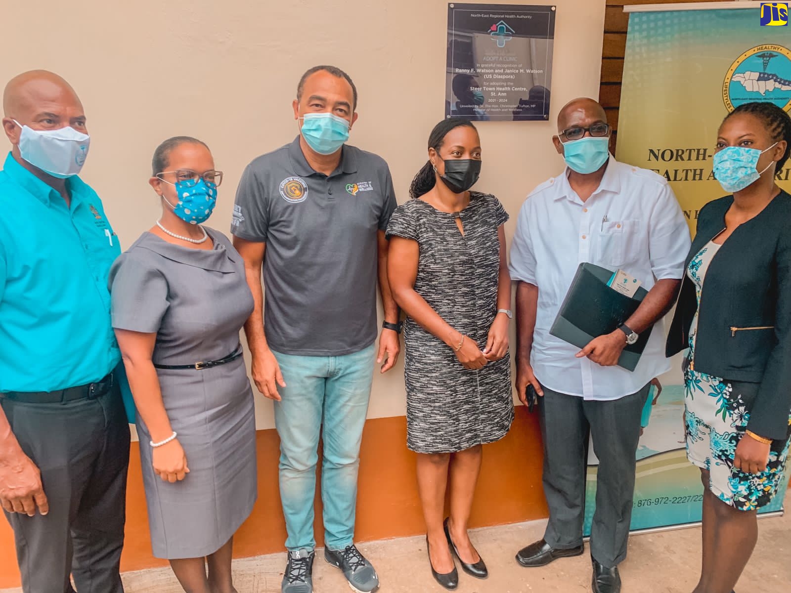 Minister of Health and Wellness, Dr. the Hon. Christopher Tufton (3rd left), Minister of State in the Ministry of Finance and the Public Service and North East St. Ann Member of Parliament, Hon. Marsha Smith (3rd right), and members of the North East Regional Health Authority with Steer Town Health Centre adopter and donor, Ranny Watson (2nd right), during the Adopt-a-Clinic ceremony on June 24.