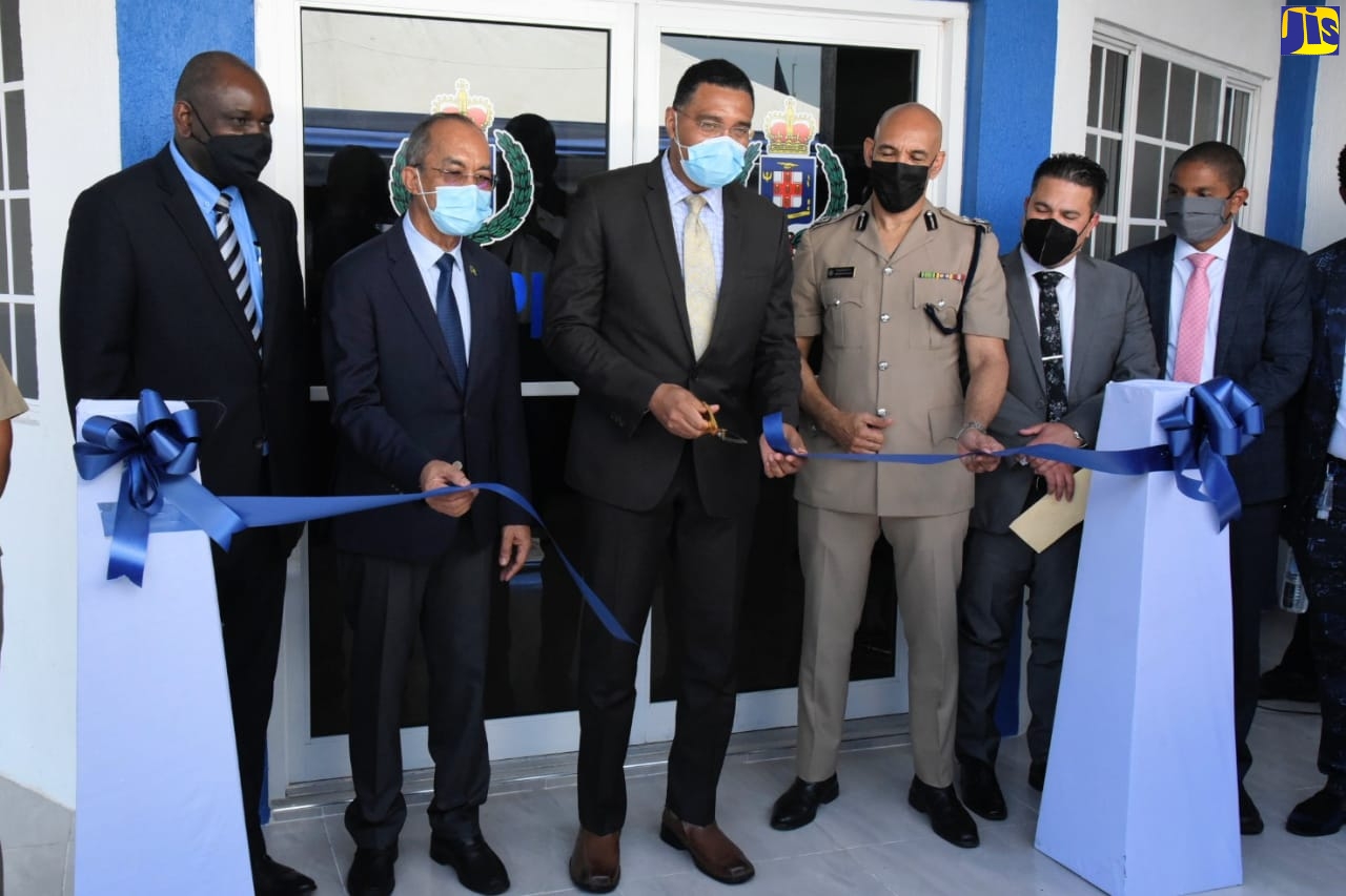 Prime Minister, the Most Hon. Andrew Holiness (centre), cuts the ribbon to officially open the new Olympic Gardens Police Station in St. Andrew on Wdnesday (June 30). Sharing the moment (from left) are Permanent Secretary in the Ministry of National Security, Courtney Williams; Minister of National Security, Hon. Dr. Horace Chang;  Commisioner of Police, Major General Antony Anderson; Minister without portfolio in the Ministry of National Security, Senator the Hon. Matthew Samuda; and Mayor of Kingston, Senator Councillor Delroy Williams.