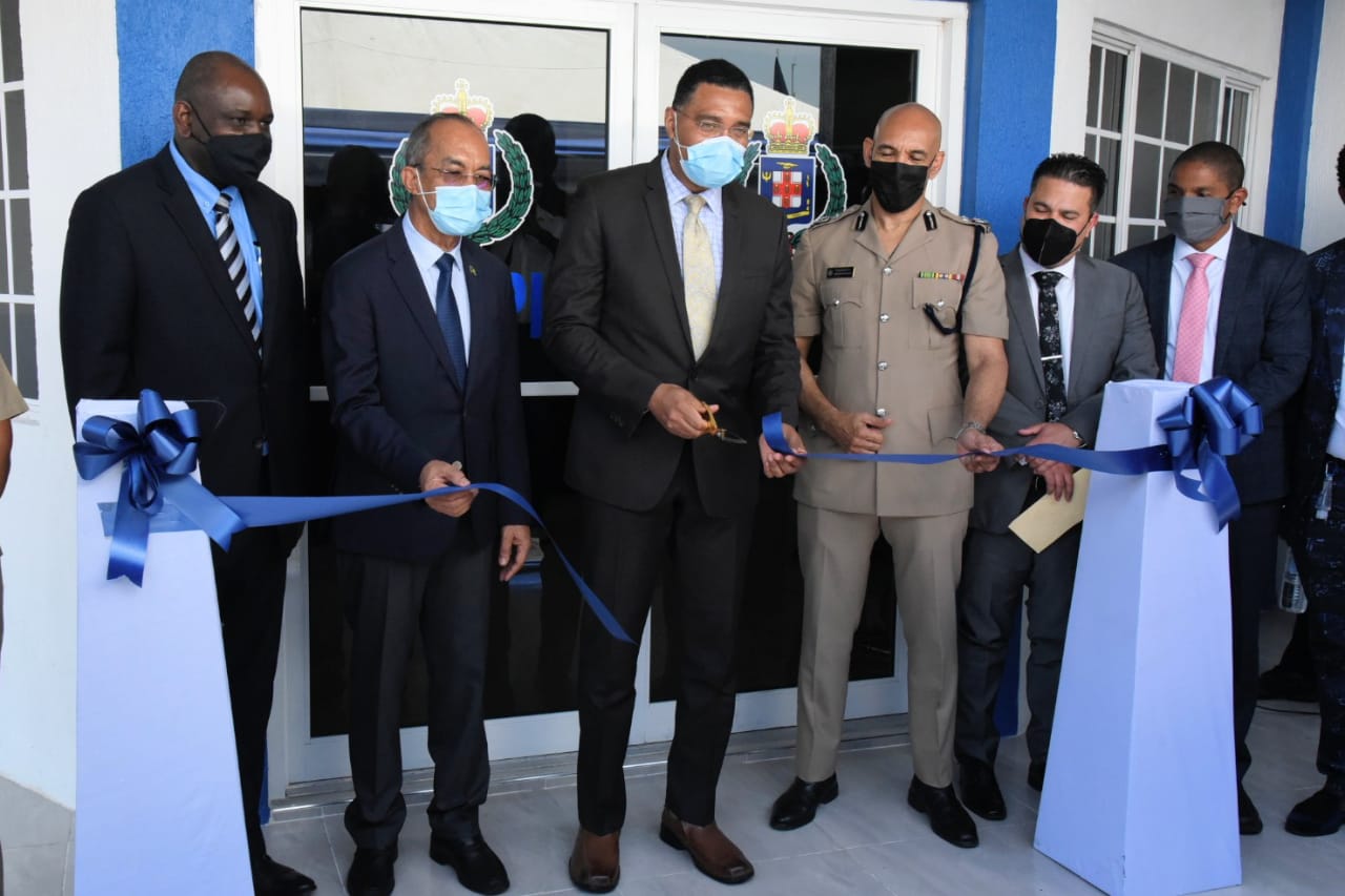 Prime Minister, the Most Hon. Andrew Holiness (centre), cuts the ribbon to officially open the new Olympic Gardens Police Station in St. Andrew on Wdnesday (June 30). Sharing the moment (from left) are Permanent Secretary in the Ministry of National Security, Courtney Williams;​ Minister of National Security, Hon. Dr. Horace Chang;  Commisioner of Police, Major General Antony Anderson; Minister without portfolio in the Ministry of National Security, Senator the Hon. Matthew Samuda; and Mayor of Kingston, Senator Councillor Delroy Williams.

