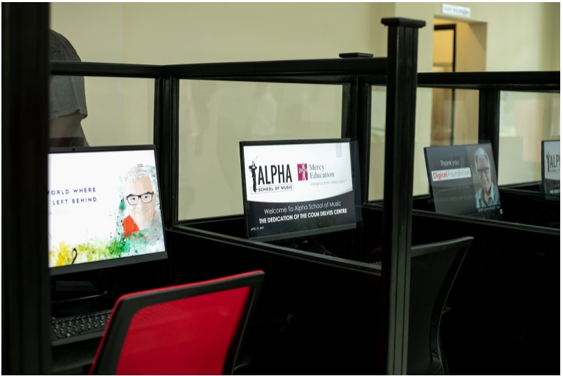 A few of the 12 computers that were purchased by the Alpha School of Music with a donation of $3.36 million from the Culture, Health, Arts, Sports, and Education (CHASE) Fund.