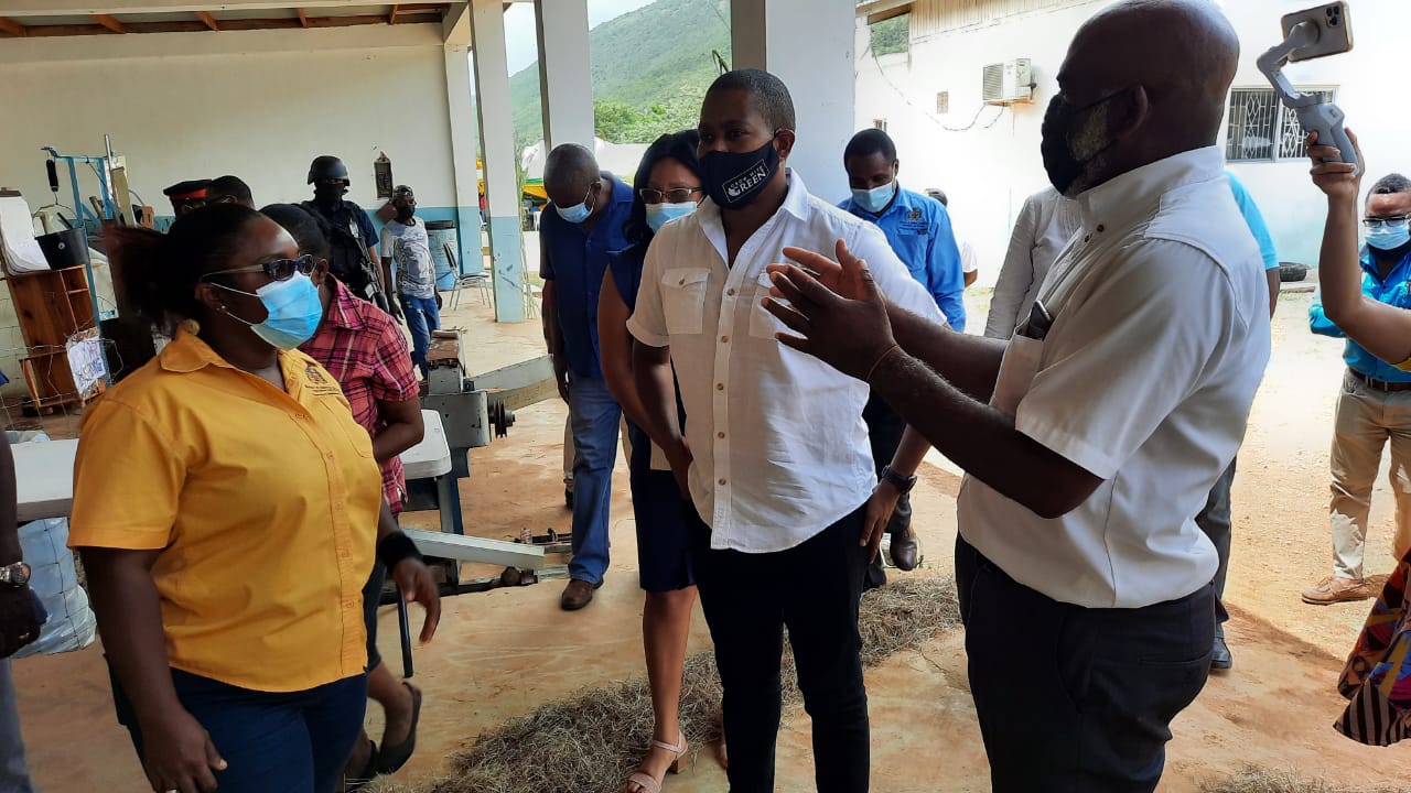 Minister of Agriculture and Fisheries, Hon. Floyd Green (centre), interacting with Livestock Research Officer, Karayan Holt (left), and Chief Livestock Research Officer in the Ministry of Agriculture and Fisheries, Audley Facey, at the launch of the National Small Ruminant Development Programme at Hounslow Research Station in St. Elizabeth recently.