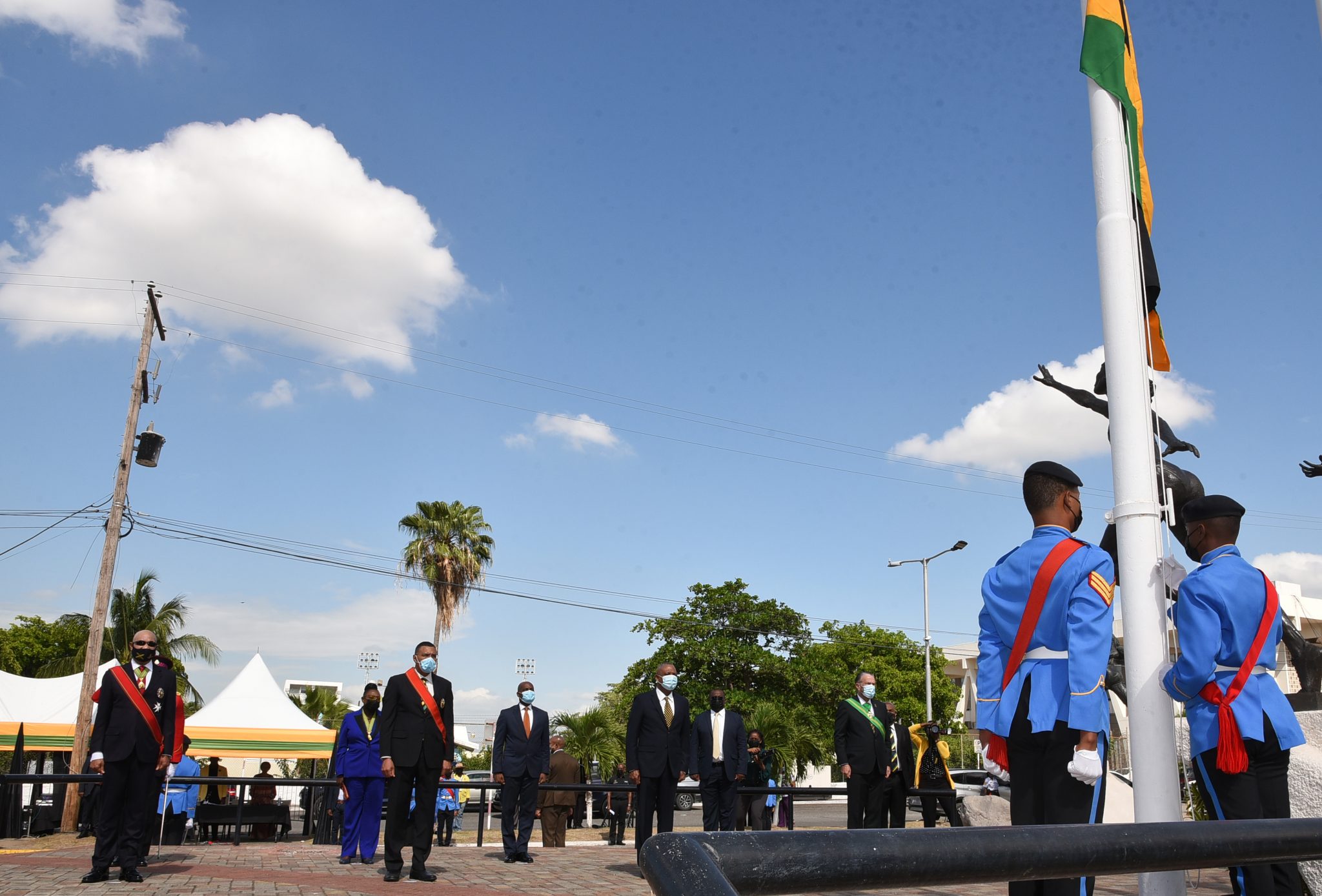 (From Left): Governor-General, His Excellency, the Most Hon. Sir Patrick Allen; Prime Minister, the Most Hon. Andrew Holness; Horace Dalley, who represented the Leader of the Opposition; and President of the Senate, Tom Tavares-Finson, observe as members of the Jamaica Combined Cadet Force (right, foreground) hoist the National Flag during Friday’s (August 6) flag raising ceremony at Statue Park, just outside the National Stadium in Kingston. The event was among the activities marking the country’s 59th Independence Day Anniversary. Also observing is Minister of Culture, Gender, Entertainment and Sport, Hon. Olivia Grange (background, 2nd left).