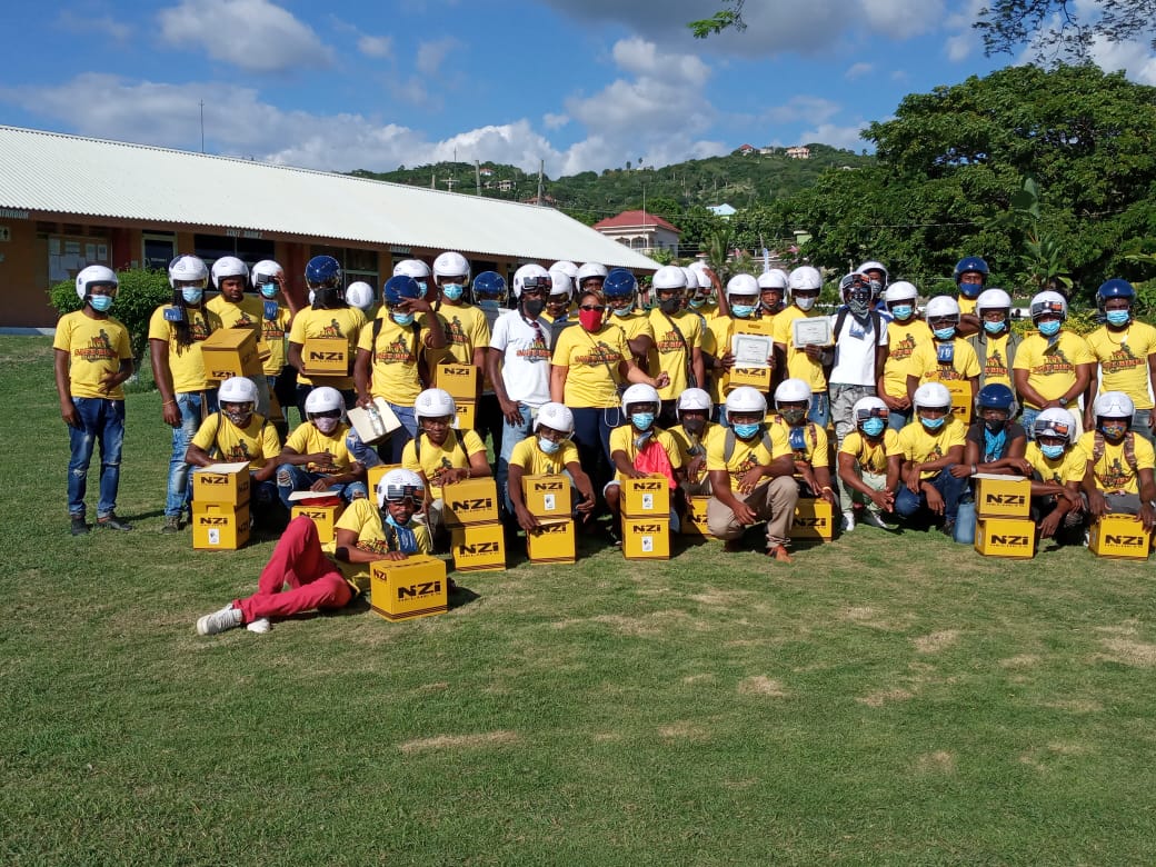 Participants in the National Road Safety Council Ministry of National Security sponsored Motorcycle Training Programme  pose with their certificates and helmets.  
Photo: contributed
