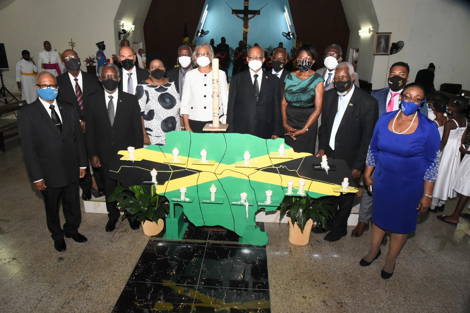 Custodes or their representatives from the 14 parishes observe a moment of reflection after lighting candles in memory of persons who have died in communities across the country due to the coronavirus (COVID-19) pandemic. Occasion was a special virtual ceremony at the St. Theresa Roman Catholic Church in Vineyard Town, St. Andrew, on August  4. The ceremony was hosted by the National Chorale of Jamaica. 

