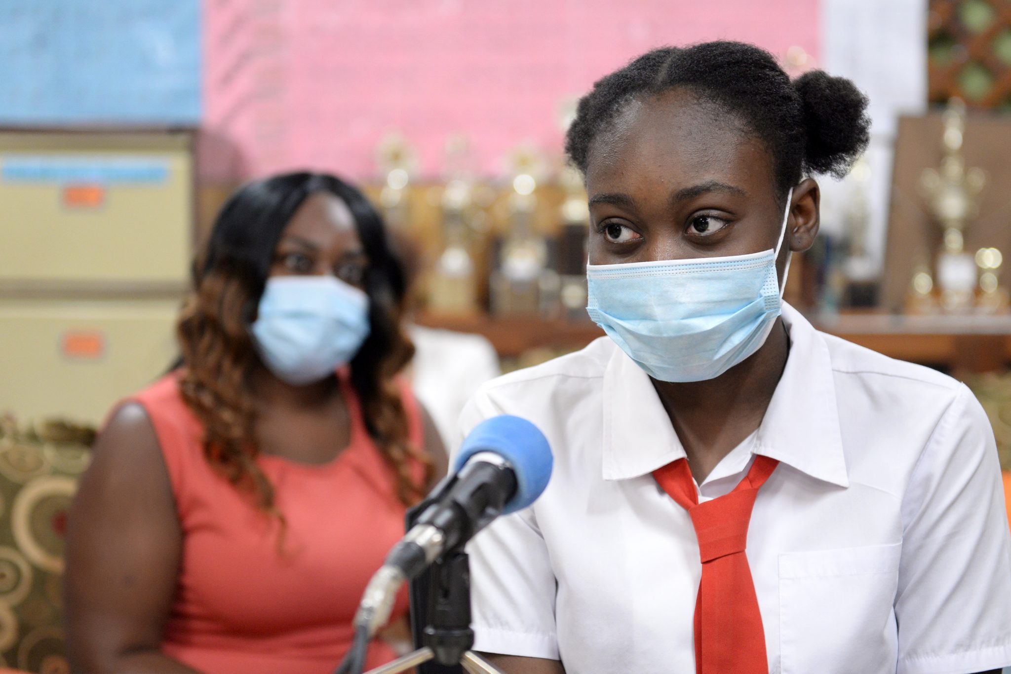 Top Student at the St. John's Primary School, Natalia Steer (right), speaks with JIS News at the St. Catherine-based institution recently. Her mother, Tedece Weir, looks on.  Photo: Dave Reid 

