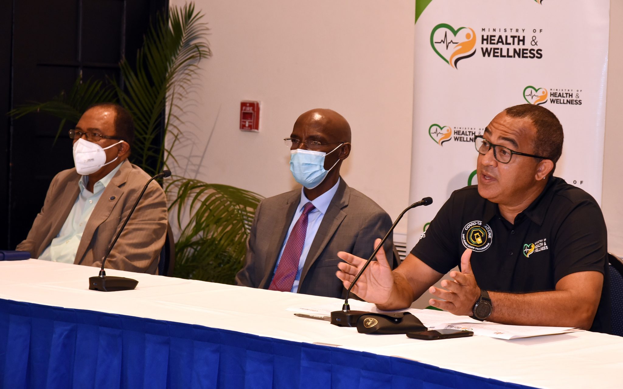 Minister of Health and Wellness, Dr. the Hon. Christopher Tufton (right), addresses a press conference providing an update on the National Vaccination Implementation Plan. The press conference was held on August 19 at The Jamaica Pegasus hotel in Kingston. Also pictured are President of the Jamaica Evangelical Alliance, Reverend Dr. Peter Garth (left), and President of the Jamaica Union Conference of Seventh-day Adventists, Pastor Everette Brown.