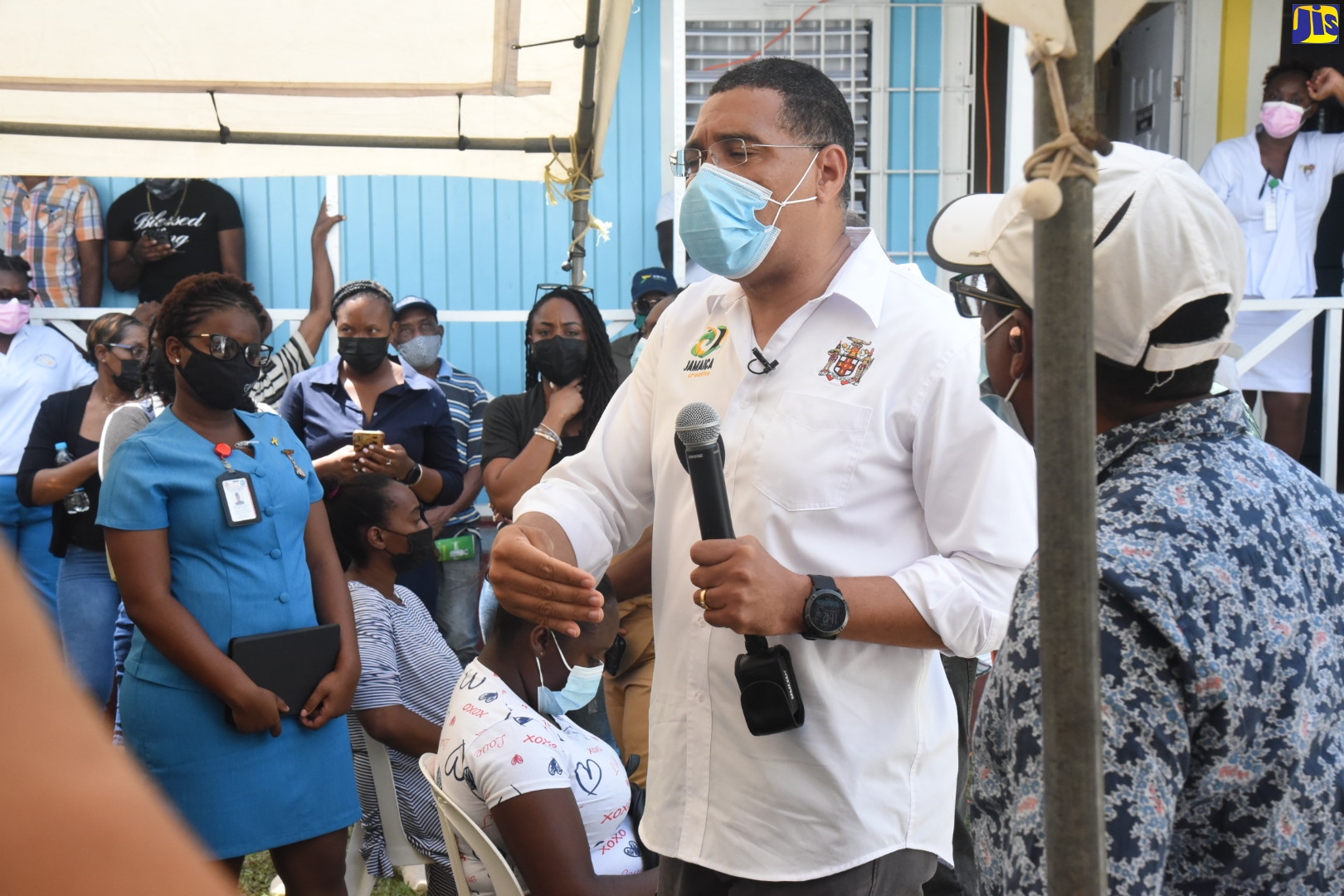 Prime Minister the Most Hon. Andrew Holness (centre), addresses persons at the Castleton Health Centre in St. Mary, on Friday (October 15). Looking on at right, is Member of Parliament for South East St. Mary, Dr. the Hon. Norman Dunn.