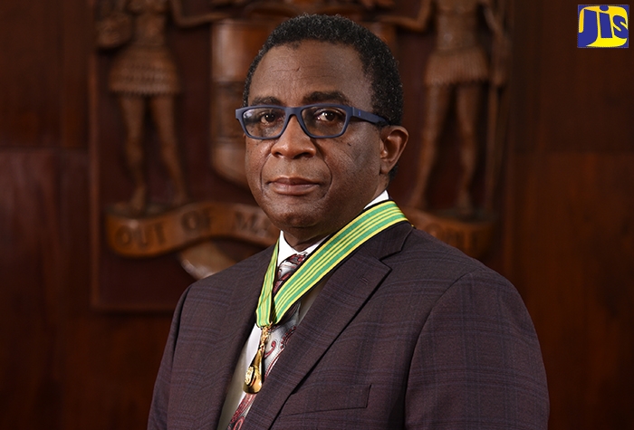 Commissioner General of Tax Administration Jamaica (TAJ), Ainsley Hugh Powell, displays the insignia of the Order of Distinction in the rank of Commander (CD), awarded to him on National Heroes’ Day,  October 18.