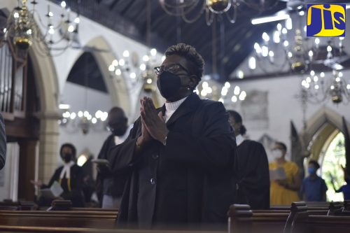 Director of Public Prosecutions, Paula Llewellyn, clasps her hands in prayer during the Annual Assize Church Service to mark the Opening Session of the Michaelmas Term of the Home Circuit Court, at the St. Andrew Parish Church on Sunday (October 24).