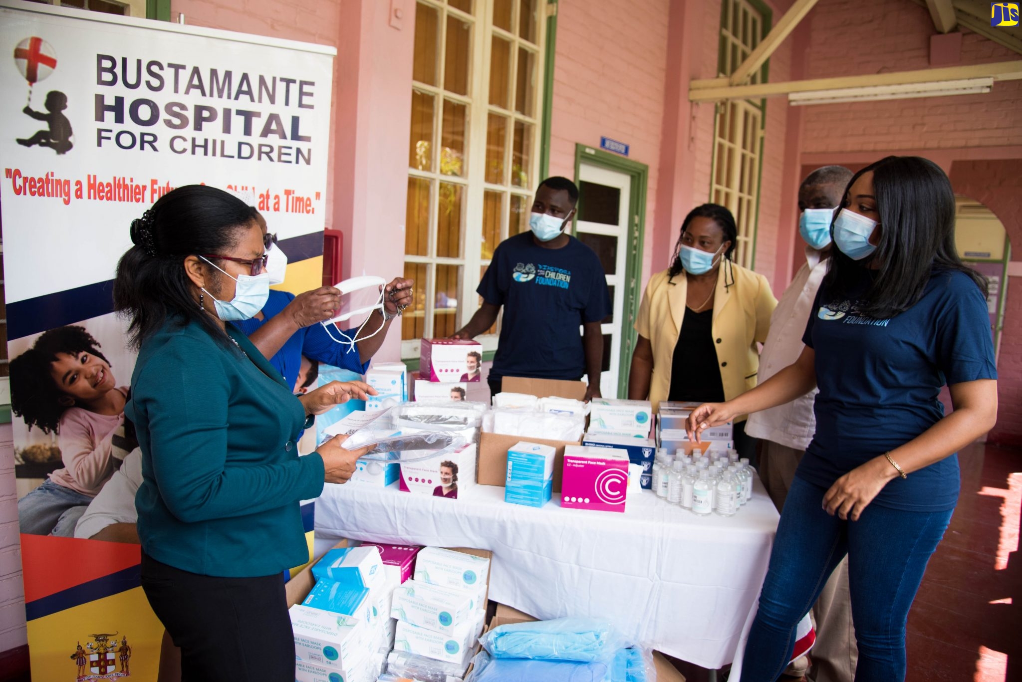 Senior Medical Officer at the Bustamante Hospital for Children Dr. Michelle-Ann Richards-Dawson (left), looks at medical items donated to the Hospital by Diaspora for Children Foundation at a hand over ceremony at the institution on Wednesday (October 20). Others pictured from left are: Director of Nursing Services, Beverley Senior-Berry (partially hidden), member of the Diaspora for Children Cadell Green, Administrator at the Hospital Karlene Taylor-McKenzie, Regional Director at the South East Regional Health Authority (SERHA) Errol Greene, and Country Representative, Diaspora for Children Foundation, Kimberly Nain.