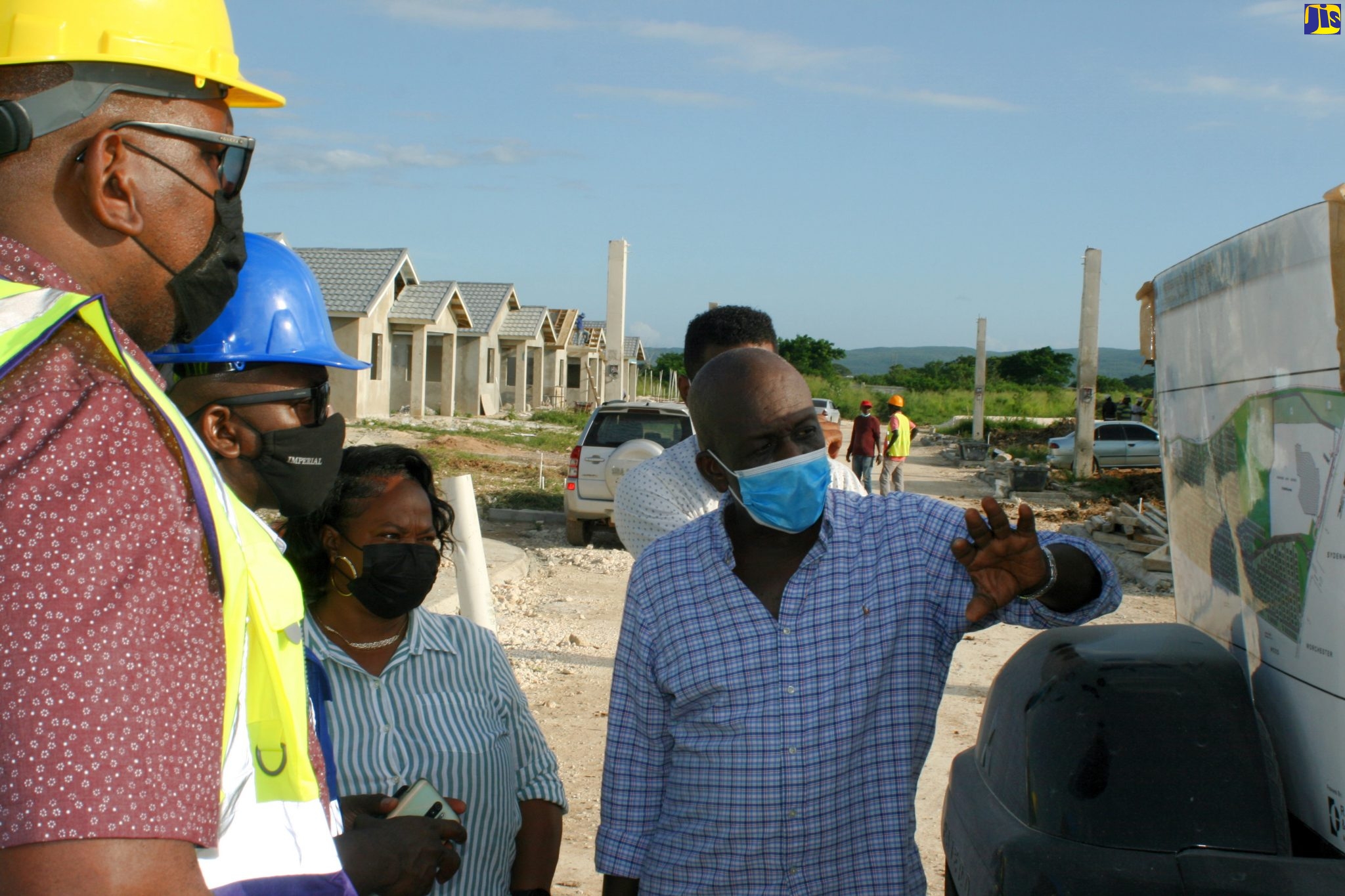 Minister of Housing, Urban Renewal, Environment and Climate Change, Hon. Pearnel Charles Jr. (second left), listens while head of Asco Project Consultants, Hugh Scott (right), outlines features of the St. Catherine-based Orchards Estate. The Minister and representatives from agencies under his Ministry were on a recent tour of the development. Others pictured from left are: Chairman of the Real Estate Board (REB), Andrew James, and Councillor for the Horizon Park Division, Jennifer Hull.