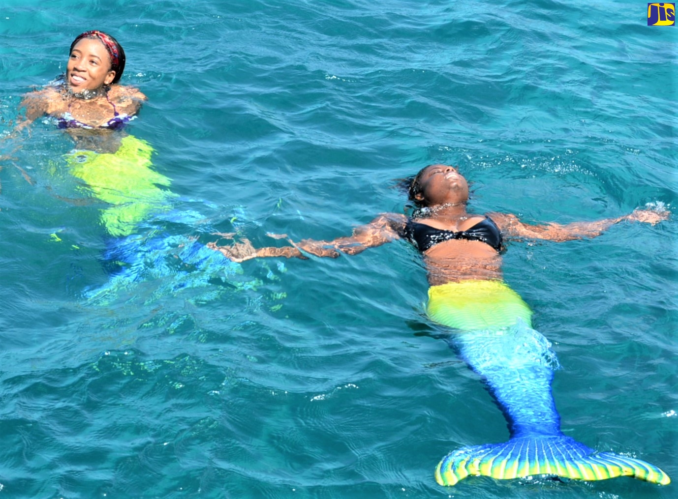 Mermaids, which are among the latest attractions at the Montego Bay Marine Park, make an appearance at the unveiling of a mermaid sculpture at the park on Saturday (October 23).