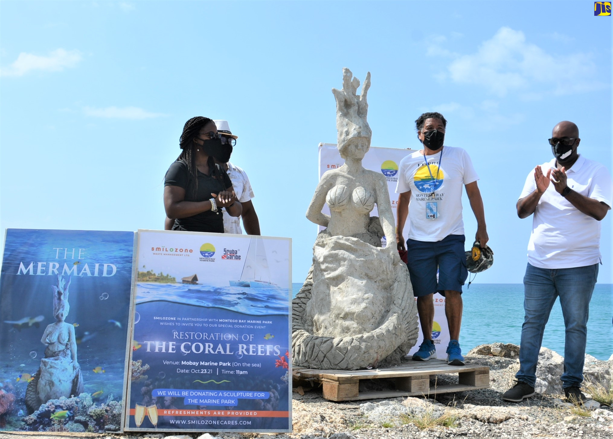 The mermaid sculpture, created through partnership  between the Montego Bay Marine Park and Smilozone Waste Management Limited, is unveiled at a press conference held on Saturday (October 23), at  the marine park.  Sharing the proud moment (from left) are Operations Manager at Smilozone Waste Management Limited, Laur-Ann Daley; Environmental Sculptor, Robert “Toby” Grant; Montego Bay Marine Park Executive Director, Hugh Shim; and Councillor Dwight Crawford of the Spring Gardens Division.