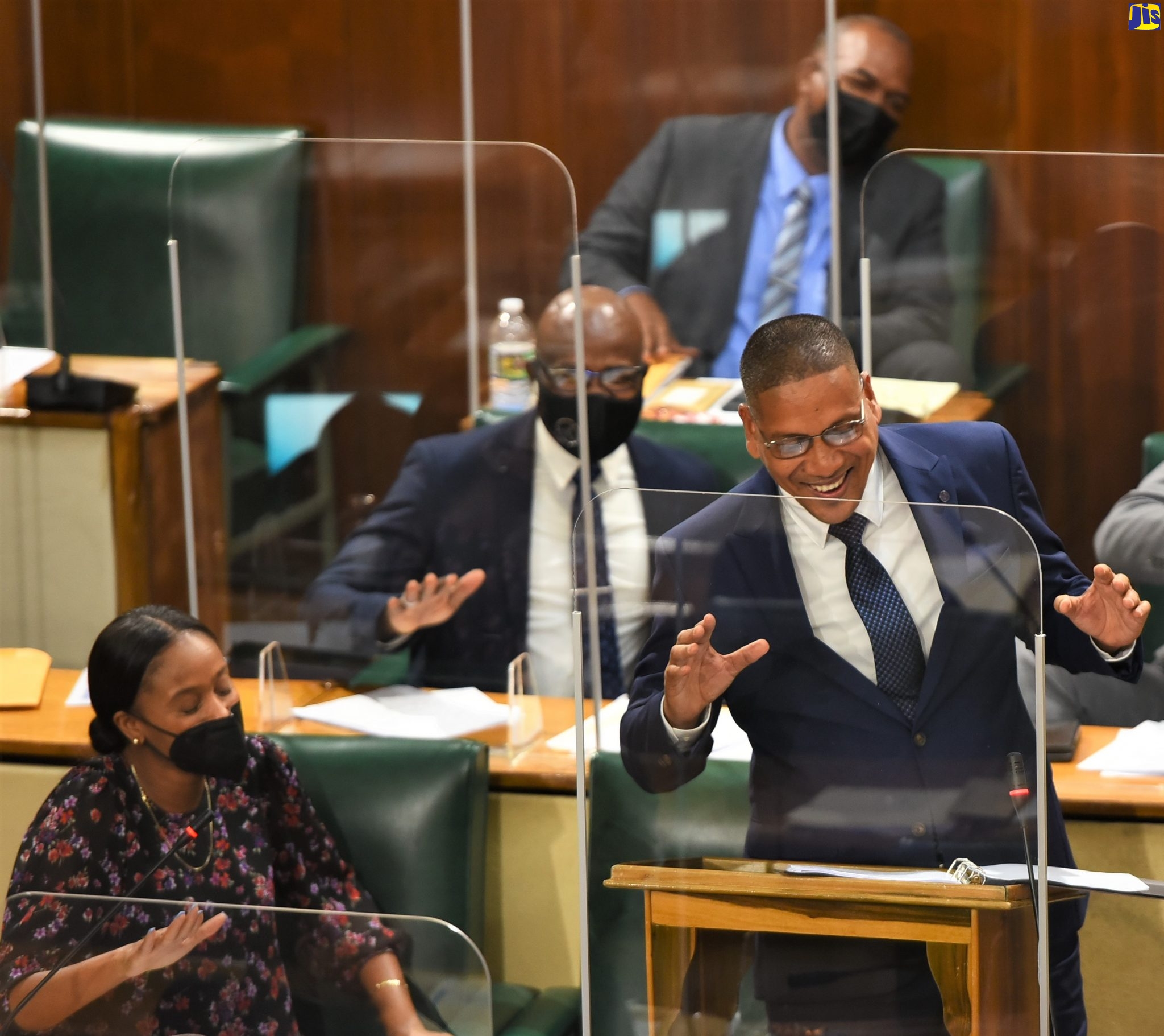 Member of Parliament (MP) for Kingston Central, Donovan Williams (at lectern), is applauded as he makes his contribution to the State of the Constituency Debate in the House of Representatives on Tuesday (October 5). 