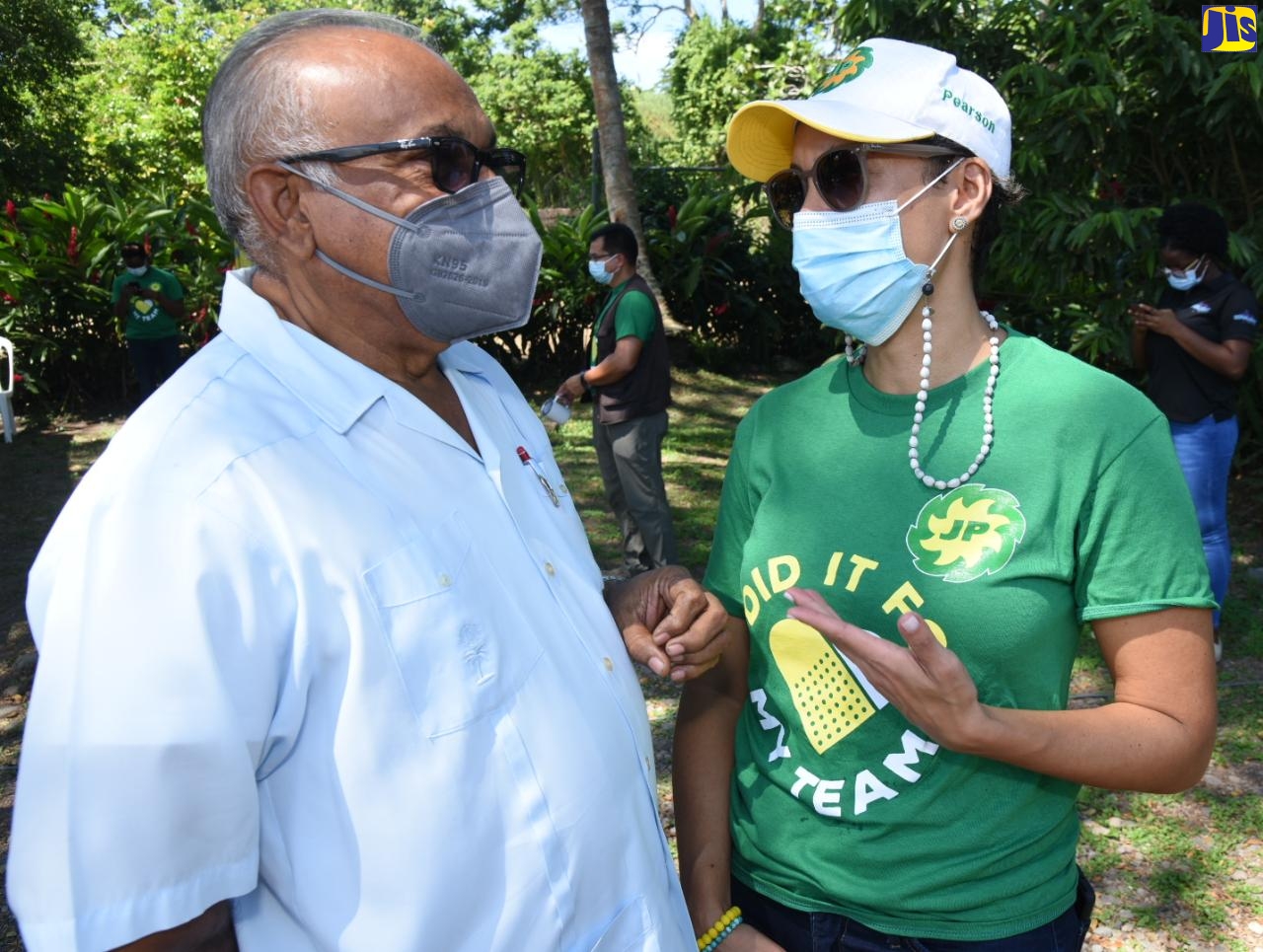 Custos of St. Mary, Hon. Errol Johnson (left), in conversation with Group General Counsel at Jamaica Producers Group (JP), Simone Pearson, at the company’s vaccination event held in Annotto Bay, St. Mary, on September 30.