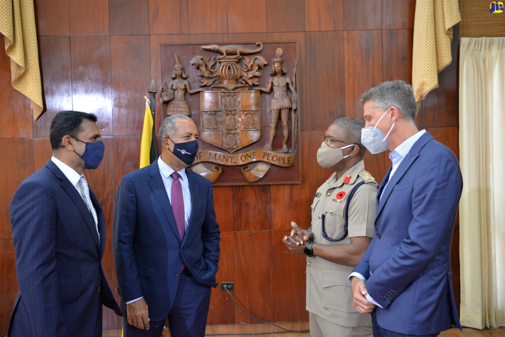 Chairman of the National COVID-19 Vaccination Operationalisation Task Force, Professor Gordon Shirley (second left), is in discussion with other members of the task force (from left) Consultant, Office of the Prime Minister, Alok Jain; Brigadier Markland Lloyd of the Jamaica Defence Force (JDF); and President and Chief Executive Officer, ICD Group Holdings Limited, Peter Melhado, during a press conference at Jamaica House on October 27.