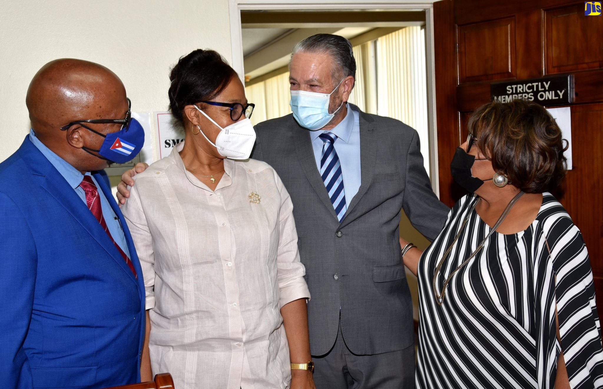 President of the Senate, Senator the Hon. Thomas Tavares-Finson (2nd right), and Speaker of the House of Representatives, Hon.  Marisa Dalrymple-Philibert (right), share a light moment with former Ambassador of the Republic of Cuba, Her Excellency Inés Fors Fernández, (second left)  and her husband, Ibrahin Ortega Oquendo, when the Ambassador made a farewell courtesy call at Gordon House in downtown Kingston, recently.