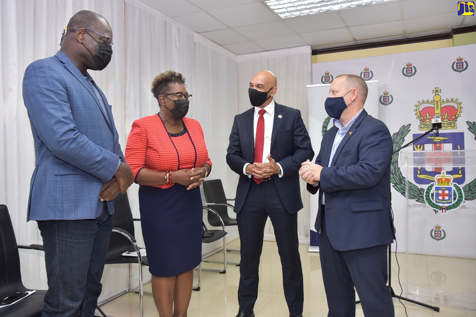 From left: Deputy Commissioner of Police, Fitz Bailey; Director of Public Prosecutions, Paula Llewellyn; Commissioner of Police, Major General Antony Anderson; and Charge d’Affaires, United States Embassy in Kingston, John McIntyre, in conversation during the virtual launch of the Jamaica Constabulary Force (JCF) Offences, Points to Prove and Authorities Handbook 2021 on Friday (November 5).