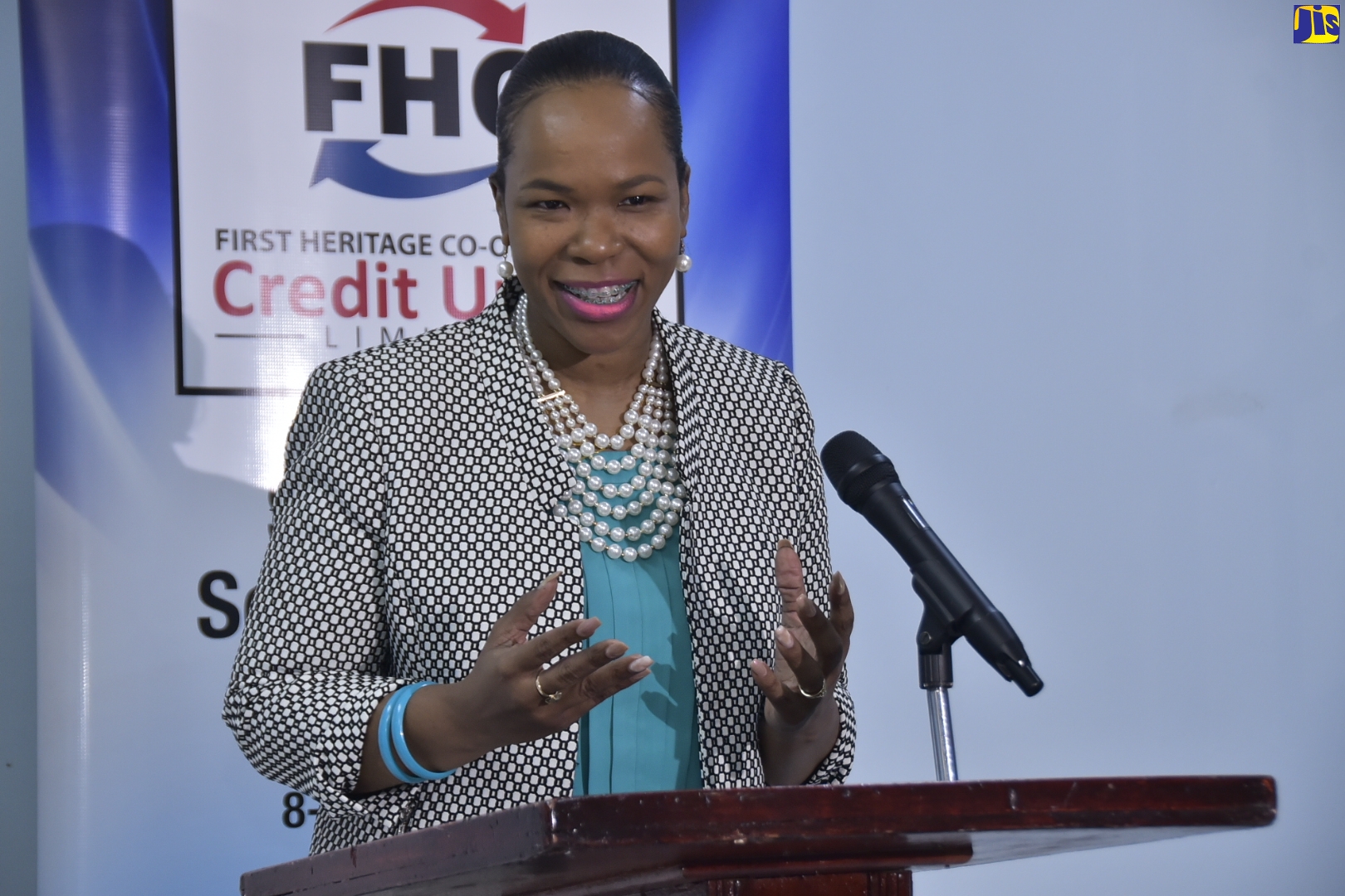 Acting Chief Education Officer in the Ministry of Education, Youth and Information, Dr. Kasan Troupe, delivers remarks at a ceremony for the handover of 100 tablets for students across the island by the First Heritage Co-Operative Union Credit Union (FHC) Foundation, at the FHC in Kingston on November 11.