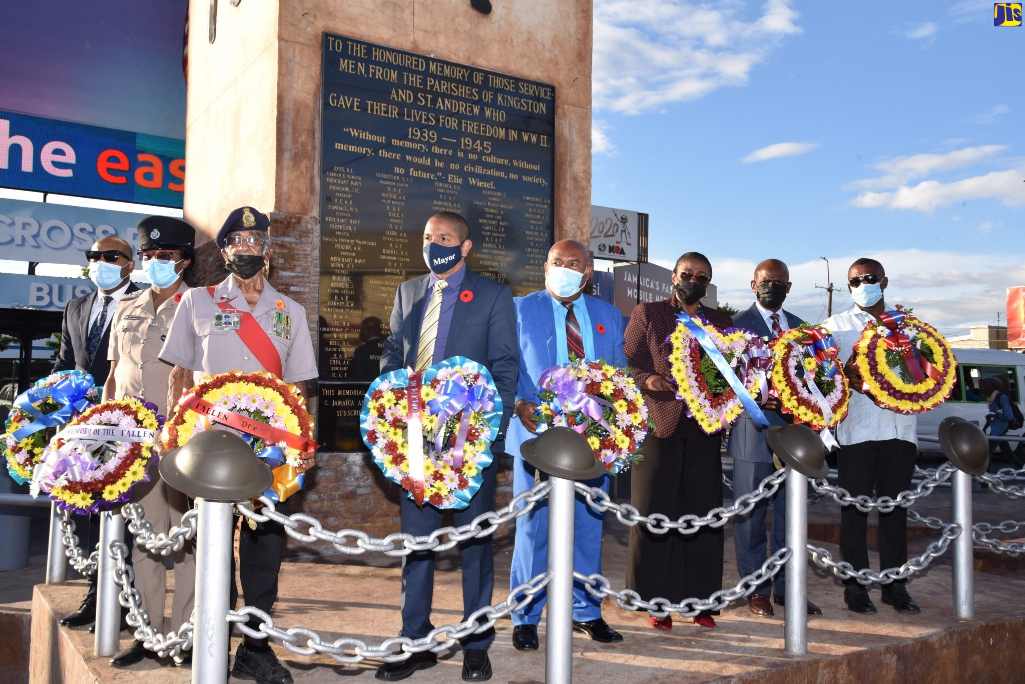 Mayor of Kingston, Senator Councillor Delroy Williams (left), leads a symbolic clock chiming and wreath-laying ceremony to honour Jamaica’s World War II veterans and reflect on the ultimate sacrifice Jamaican men and women paid for freedom. The ceremony was held at the Cross Roads Clock Tower in Kingston on November 11. The Mayor is joined by (from second left) Chief Executive Officer (Town Clerk), Kingston and St. Andrew Municipal Corporation (KSAMC), Robert Hill; Deputy Superintendent of Police, Yvette Burgess; Retired Jamaica Defence Force (JDF) Sergeant, Peter Xavier Williams; Deputy Mayor, KSAMC, Winston Ennis; Custos Rotulorum for St. Andrew, Dr Patricia Dunwell; Custos Rotulorum of Kingston, Hon Steadman Fuller; and Minority Leader, KSAMC, Andrew Swaby.