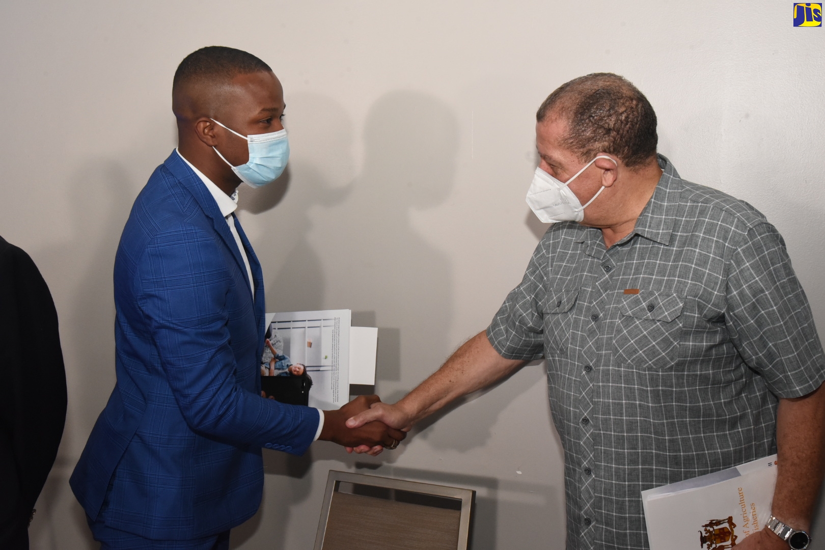 Minister of Industry, Investment and Commerce, Hon. Audley Shaw (right), greets Executive Chairman of BluShip Cargo and Freight Limited, Daren Miller, during the entity’s 2021 Corporate Linkages on the Trade in Cultural Goods semi-virtual media briefing, at the AC Marriott Kingston Hotel, on Thursday (November 25). Mr. Shaw was the keynote speaker.