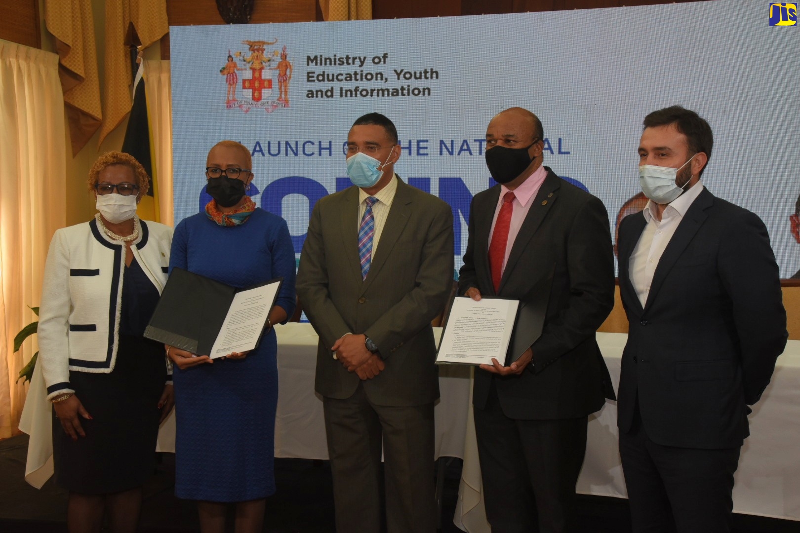 Prime Minister, the Most Hon. Andrew Holness (centre), and Minister of Education, Youth and Information, Hon. Fayval Williams (second left) participate in the launch of the National Coding in Schools Programme, during a virtual ceremony on Friday (Nov. 19). The function involved the signing of a Memorandum of Understanding (MoU) to facilitate the implementation of the initiative, which will benefit 400,000 students in grades one to 13 in public schools across the country. Other participants (from left) are: Acting Permanent Secretary in the Education Ministry, Maureen Dwyer; Managing Director, Amber Group, Michael McNaughton; and Chief Executive Officer (CEO), Digicel Jamaica, Jabbor Kayumov.