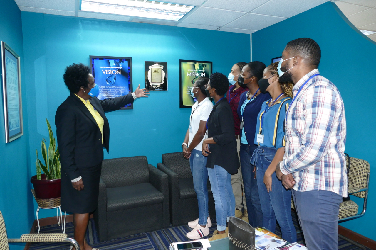 Mrs Andrea Edwards-Gyles (left), the Vice President for Corporate Services, explains the National Water Commission’s mission and vision to the group of engineering interns during their visit to the NWC’s corporate office in New Kingston recently. 