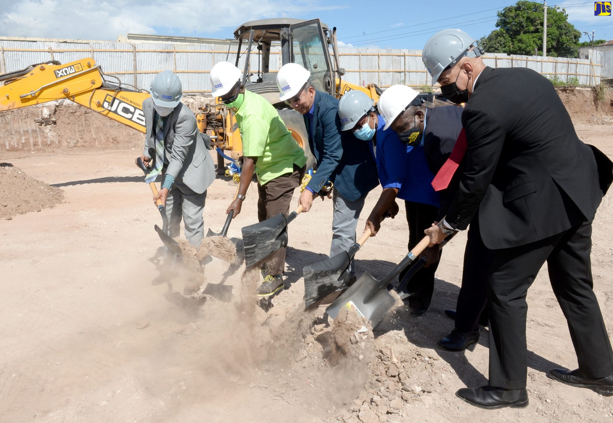Deputy Prime Minister and Minister of National Security, Hon. Dr. Horace Chang (third left), breaks ground for construction of a state-of-the-art forensic pathology autopsy suite at 149 Orange Street, downtown Kingston, on Friday (November 12). Joining the Minister (from left) are Mayor of Kingston, Senator Councillor Delroy Williams;  Minister of Local Government and Rural Development, Hon. Desmond McKenzie; Executive Director, Institute of Forensic Science and Legal Medicine, Dr. Judith Mowatt; Permanent Secretary in the Ministry of National Security, Courtney Williams; and Commissioner of Police, Major General Antony Anderson.