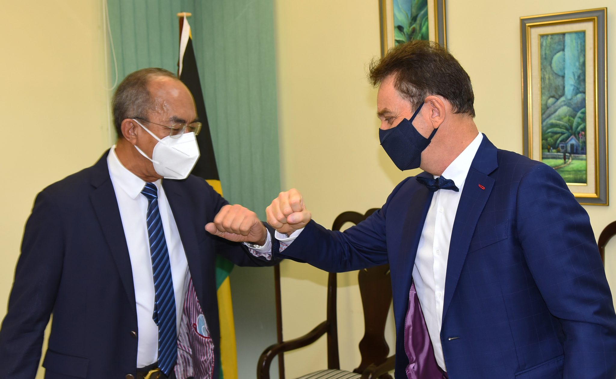 Deputy Prime Minister and Minister of National Security, Hon. Dr. Horace Chang (left), greets French Ambassador to Jamaica, His Excellency Olivier Guyonvarch, during a courtesy call at the Minister’s New Kingston offices on November 24.

