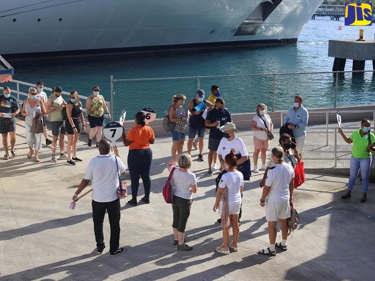 Cruise-ship passengers await instructions from dispatchers to go on approved tours in Ocho Rios, St. Ann. The visitors arrived on a cruise ship, which docked at the Reynolds Pier on November 15.