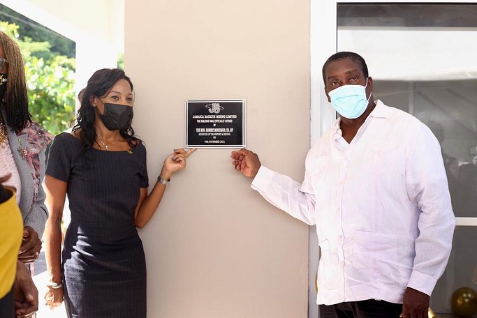 Minister of Transport and Mining, Hon. Robert Montague (right) and Minister of State in the Ministry of Finance and the Public Service, Hon. Marsha Smith, point to the plaque dedicating the Jamaica Bauxite Mining Limited’s administrative building, during the official opening on Friday (November 19), at Reynold’s Pier in Ocho Rios, St. Ann.

