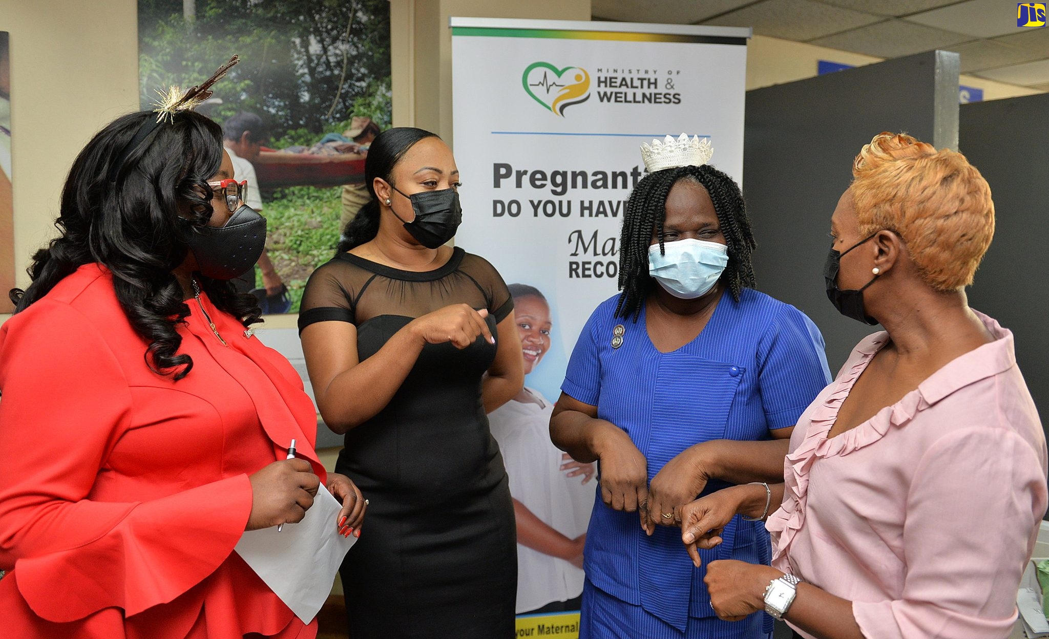 Minister of State in the Ministry of Health and Wellness, Hon. Juliet Cuthbert-Flynn (right) speaks with (from left): Lieutenant Governor Elect, Kiwanis Division 23 East, Carolyn McDonald-Riley; Portfolio Manager, Kirk Distributors Ltd., Keisha Stewart; and Director, Nursing Services at the Victoria Jubilee Hospital (VJH), Elise Fairweather- Blackwood, during a visit to the Victoria Jubilee Hospital in Kingston on December 25.
