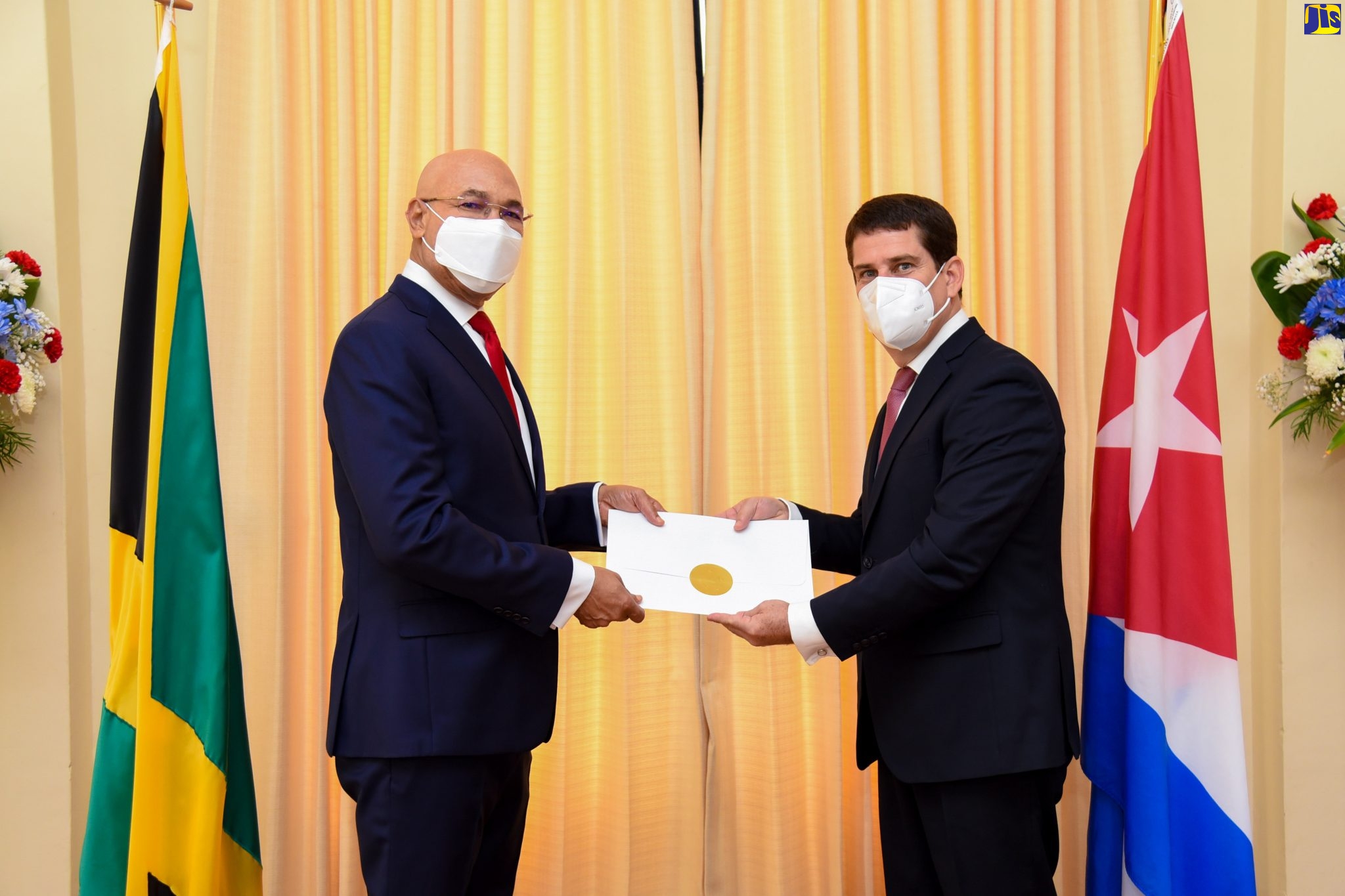 Governor-General, His Excellency, the Most Hon. Sir Patrick Allen (left), receives Letters of Credence from newly appointed Cuban Ambassador to Jamaica, His Excellency Fermîn Gabriel Quiñones Sanchéz, during a courtesy call at King’s House on Monday (January 24).