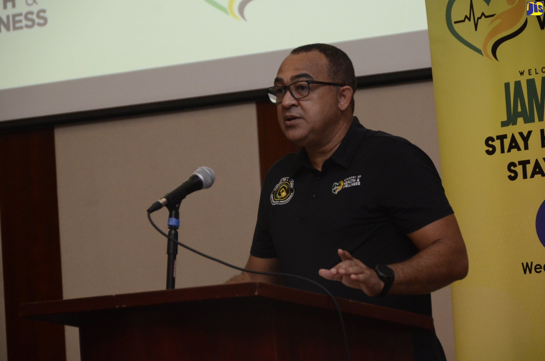 Minister of Health and Wellness, Dr. the Hon. Christopher Tufton, addressing a handover ceremony for 5,000 coronavirus (COVID-19) home testing kits presented to the Jamaica Hotel and Tourist Association (JHTA) for tourism workers, at the Montego Bay Convention Centre, in Rose Hall, St. James, on December 30.