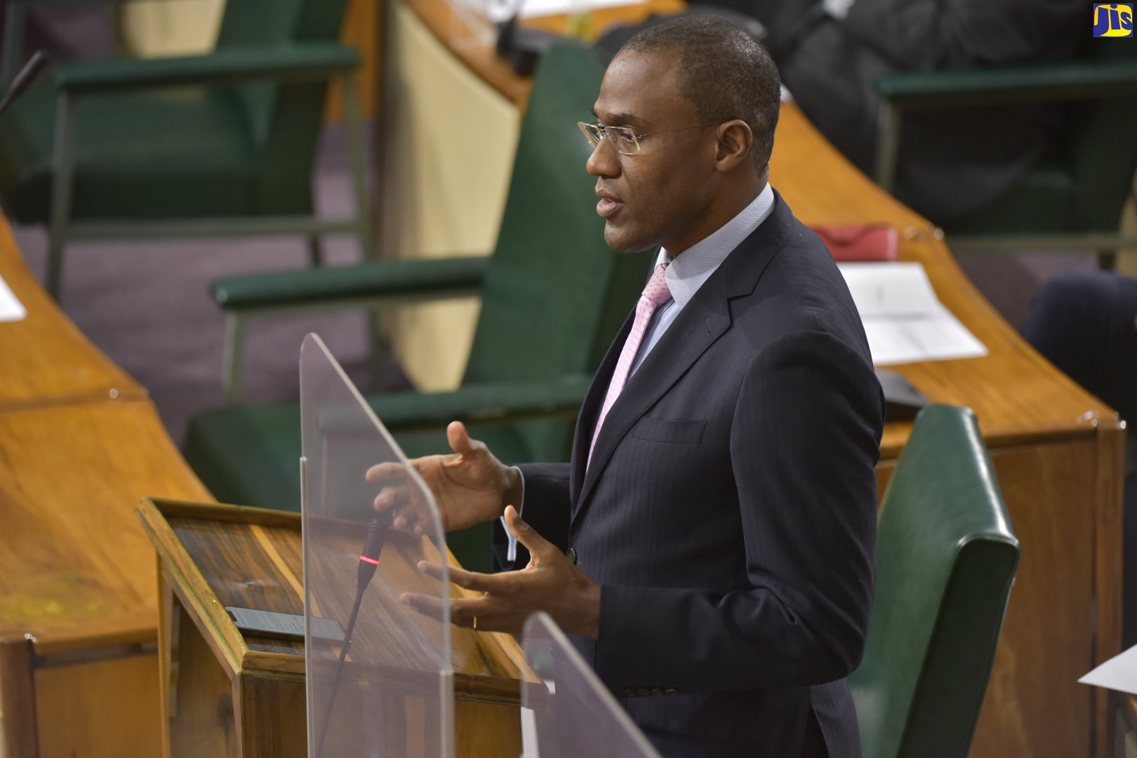 Minister of Finance and the Public Service Dr. the Hon. Nigel Clarke, discusses a matter of importance while making his contribution to the debate on the Second Supplementary Estimates for the 2021/22 fiscal year, during a special sitting of the House of Representatives on Thursday (Jan. 13).