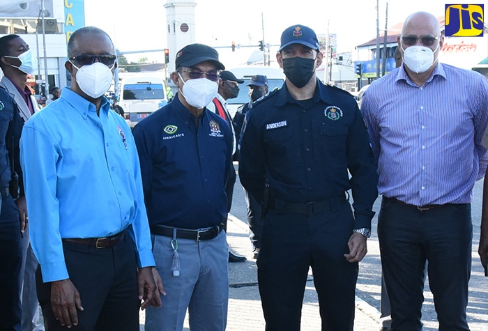 Minister of National Security, Hon. Dr. Horace Chang (second left), pictured with (from left) Vice Chairman of the Road Safety Council, Dr. Lucien Jones; Police Commissioner, Major General Antony Anderson; and President, Private Sector Organisation of Jamaica, Keith Duncan. The occasion was a site visit in Half-Way Tree on January 12 to witness the use of the Jamaica Constabulary Force (JCF) new Smart Check E-Ticketing System.  