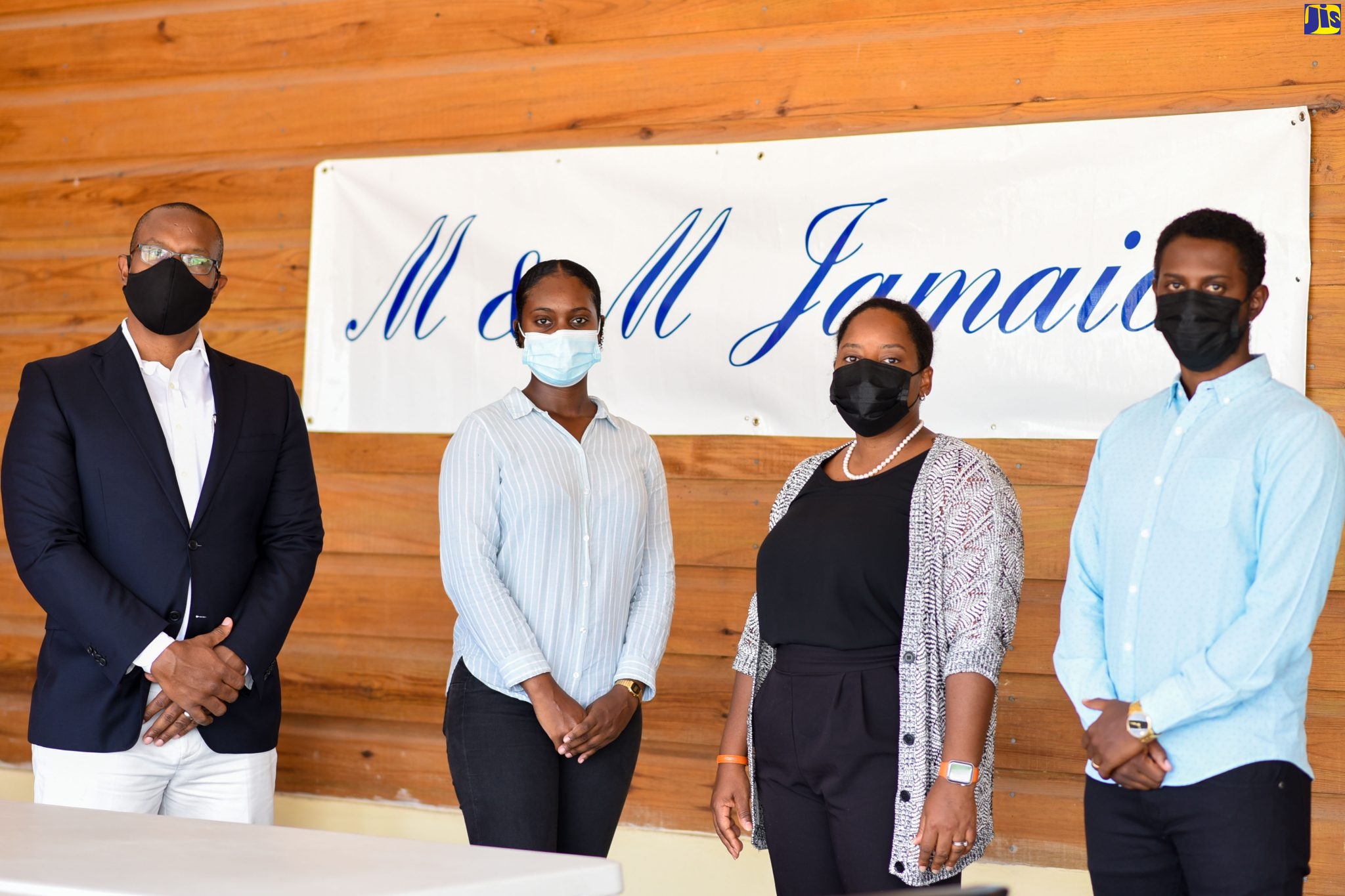 Deputy Managing Director of M&M Jamaica Limited, Richard Mullings (left), along with (from left) intern with the company Lesmar Murray, Director Danae Mullings-Makoso, and Planning Engineer, Shane Moodie, highlighting the company’s support for youth development at its Molynes Road office in St. Andrew.  