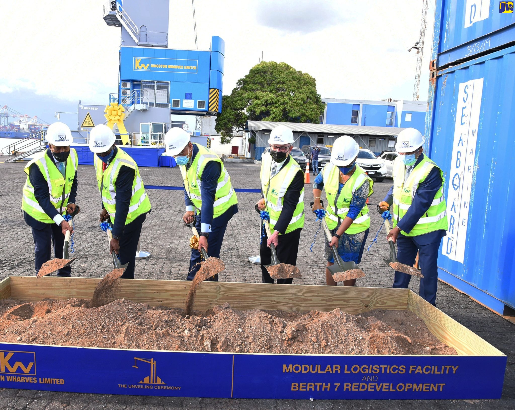 Prime Minister, the Most Hon. Andrew Holness (third left), breaks ground at the unveiling of the Kingston Wharves Limited (KWL) US$60-million investment in logistics and port development, at Port Bustamante, on Wednesday (January 12). Sharing in the occasion (from left) are President and Chief Executive Officer of the Port Authority of Jamaica (PAJ), Professor Gordon Shirley; Chief Executive Officer for KWL, Mark Williams; Chairman of the company, Jeffrey Hall; Group Financial Officer, Clover Moodie, and Deputy Chairman of KWL, Grantley Stephenson.