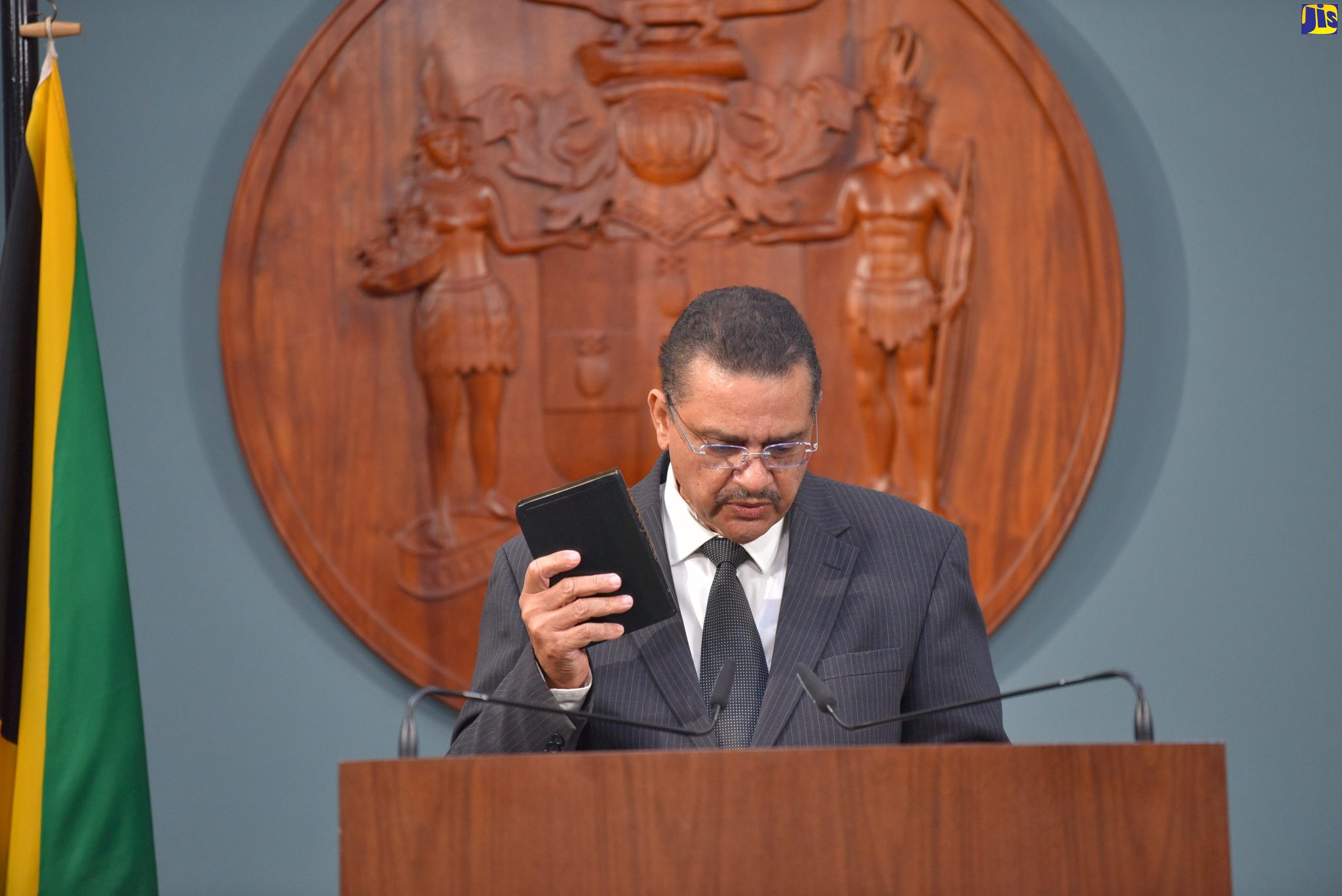 Newly appointed Attorney General, Dr. Derrick McKoy, takes the Oath of Office and Oath of Allegiance during a virtual swearing-in ceremony, on Tuesday (January 11).