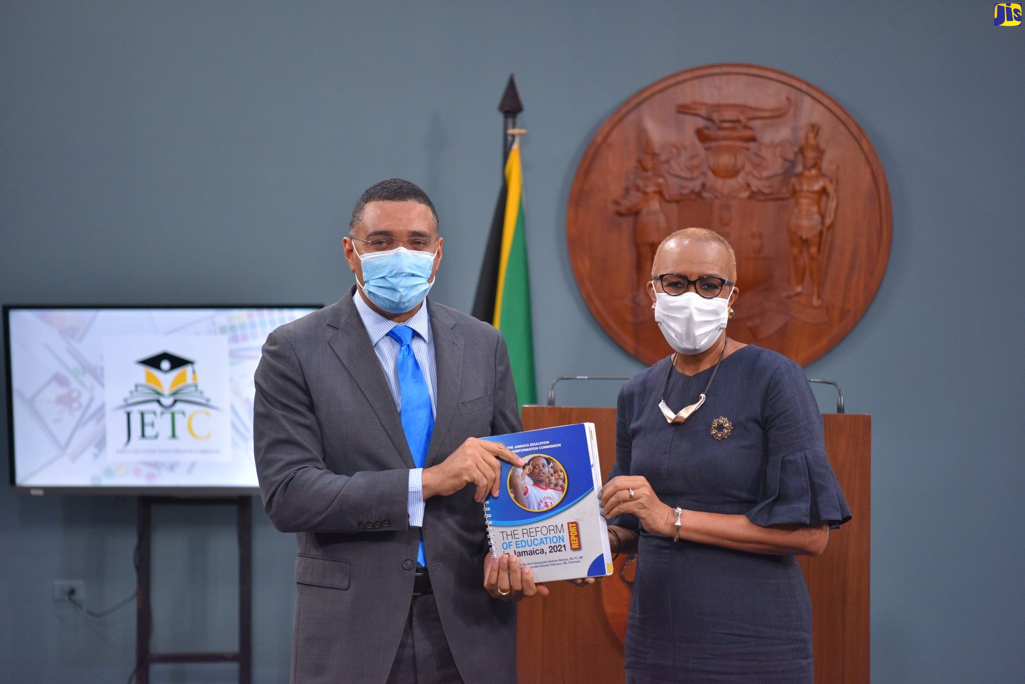 Prime Minister, the Most Hon. Andrew Holness (left), and Minister of Education and Youth, the Hon. Fayval Williams, display the ‘The Reform of Education in Jamaica 2021 Report’ at the virtual launch on Thursday (January 13). Developed by the Jamaica Education Transformation Commission (JETC), the report is a blueprint for the establishment of a  comprehensive strategy to improve student performance and educational productivity across the sector.