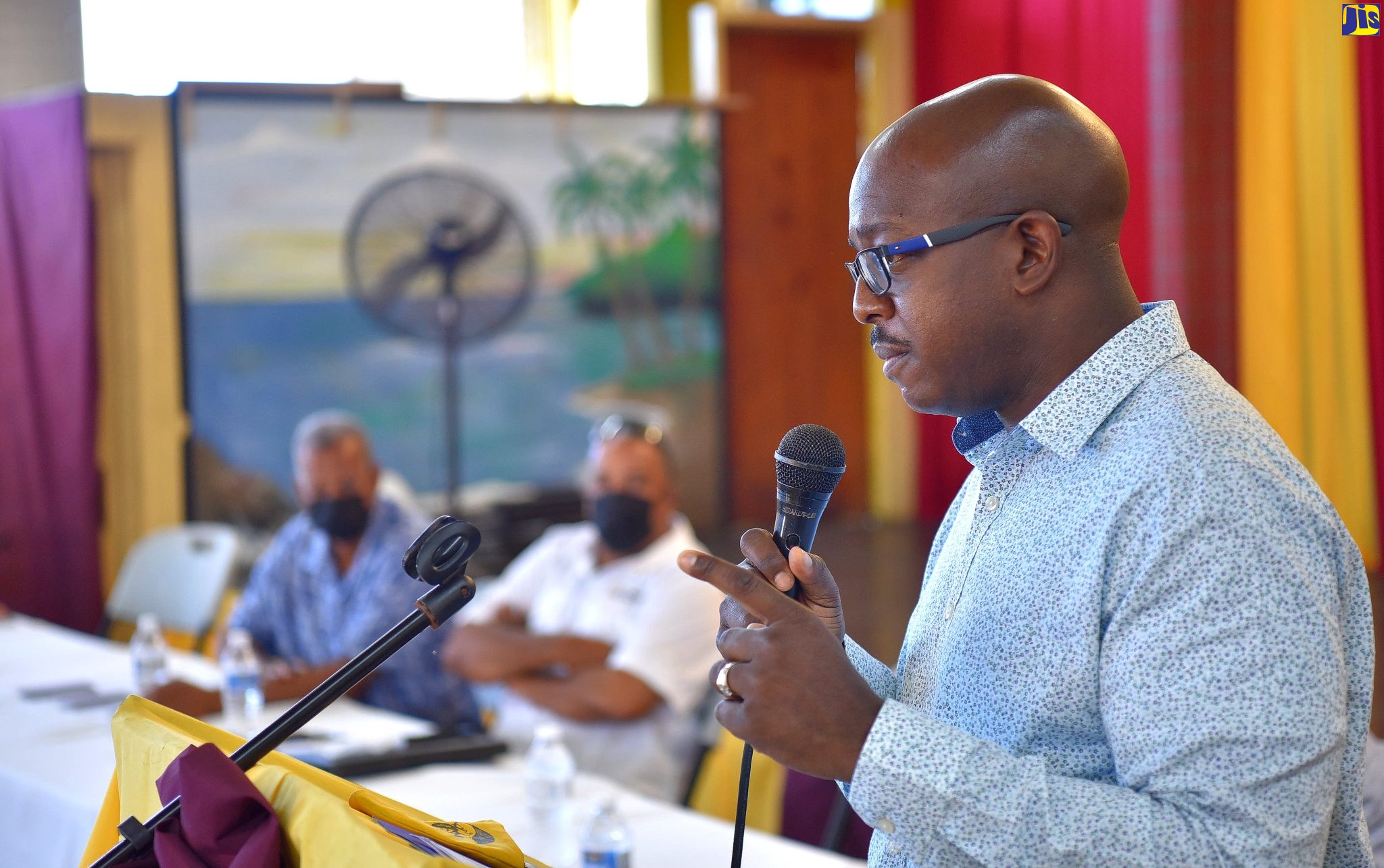 Minister of Agriculture and Fisheries, Hon. Pearnel Charles Jr.(right), addresses the Annual General Meeting of the Middlesex Broiler Farmers Association, held on February 5 at Dinthill Technical High School in St. Catherine.